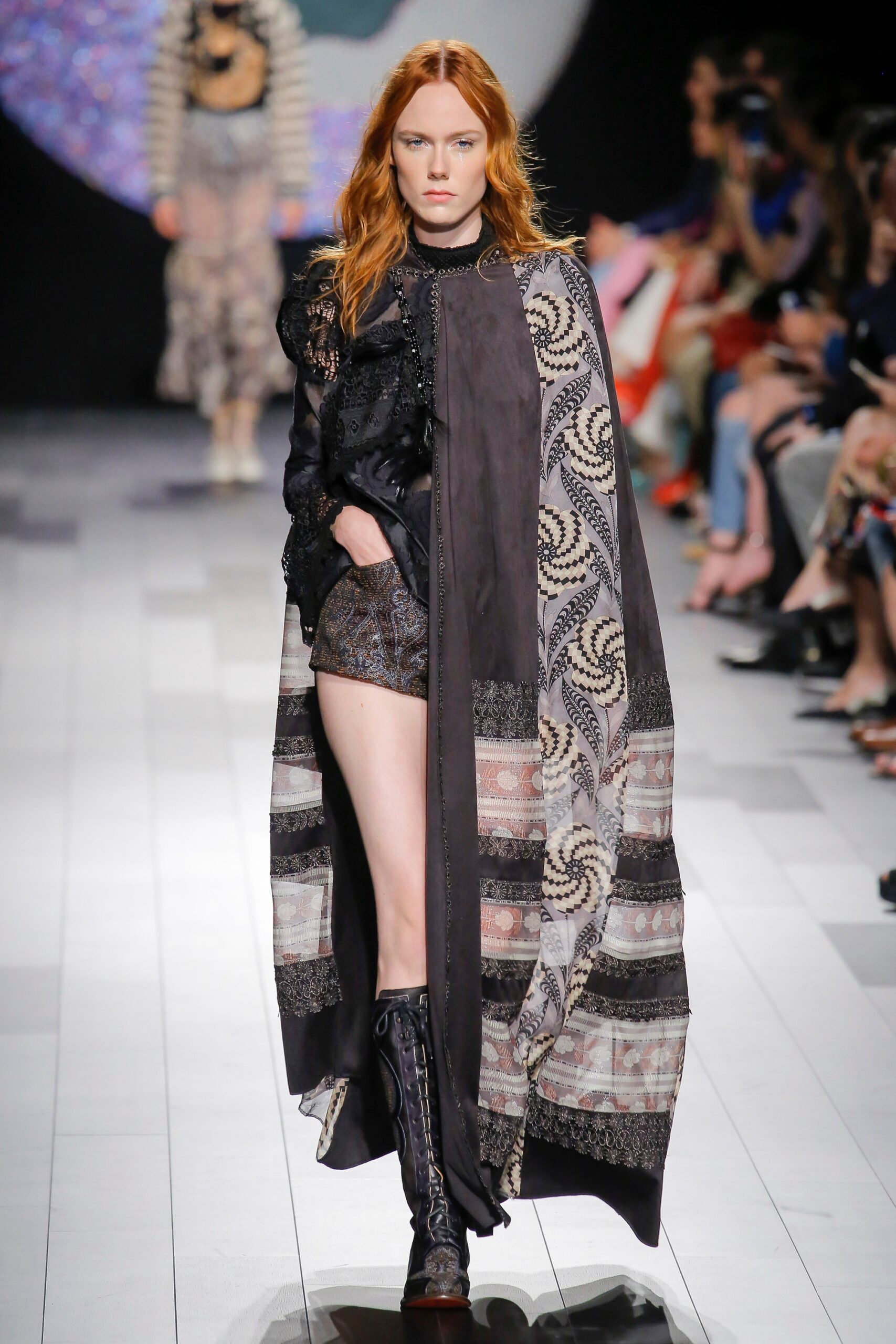 black multi-layered cape and shorts