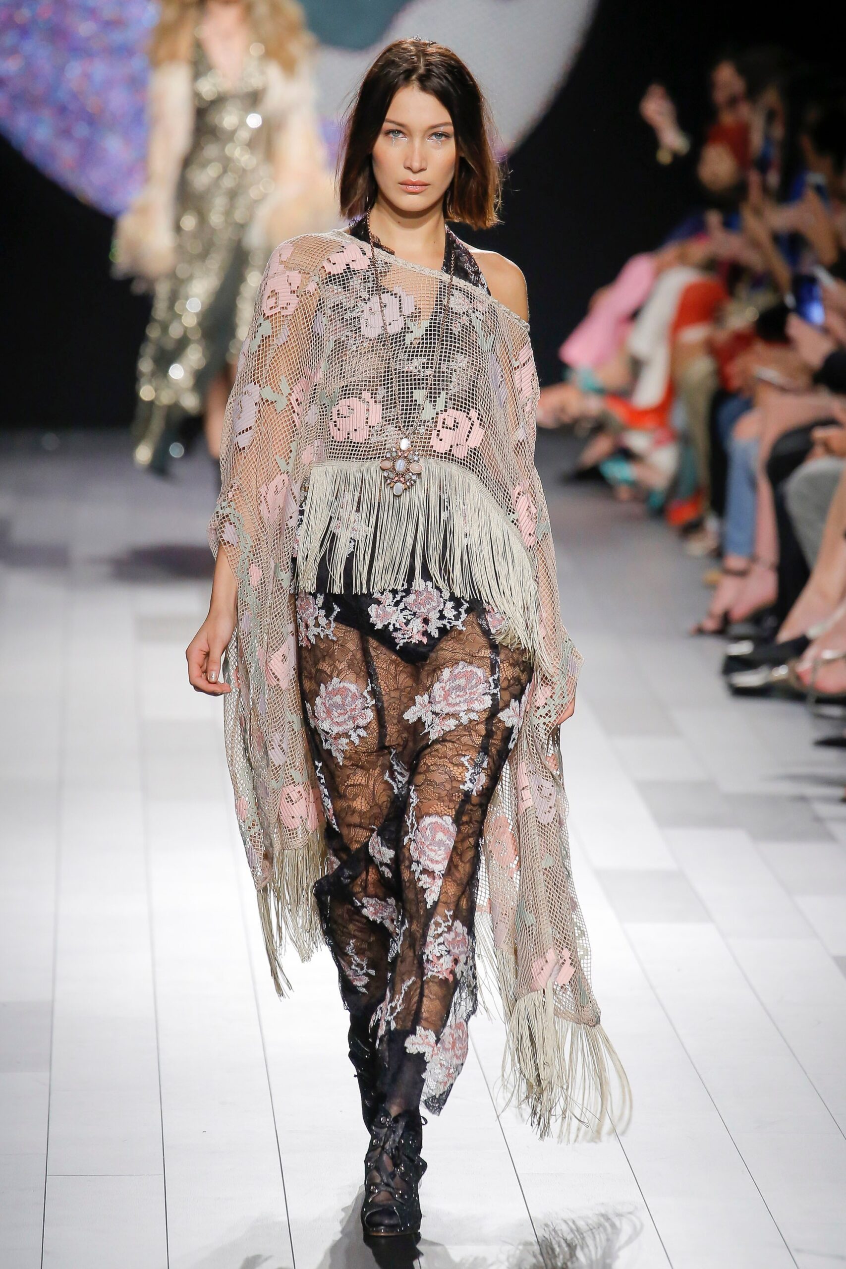 pink lace poncho with black pants