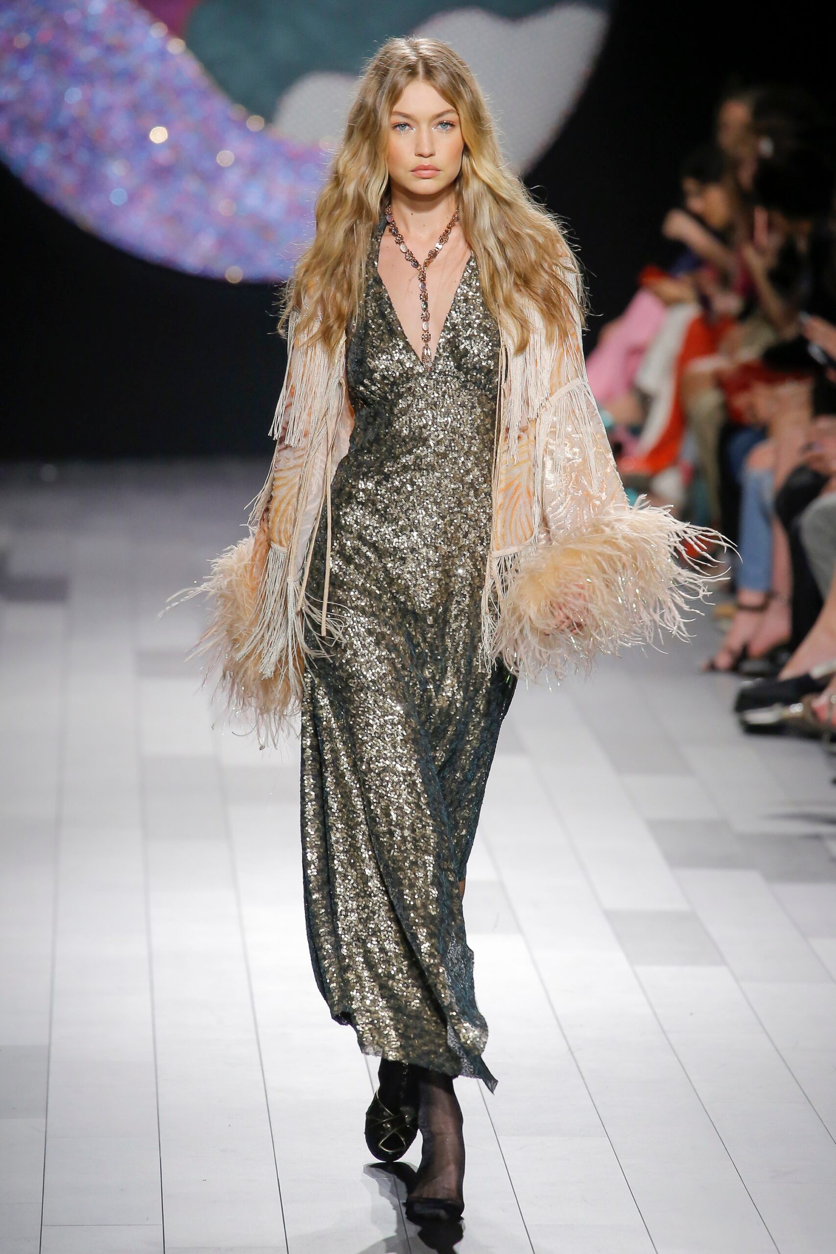 gold sequin gown with beige cape