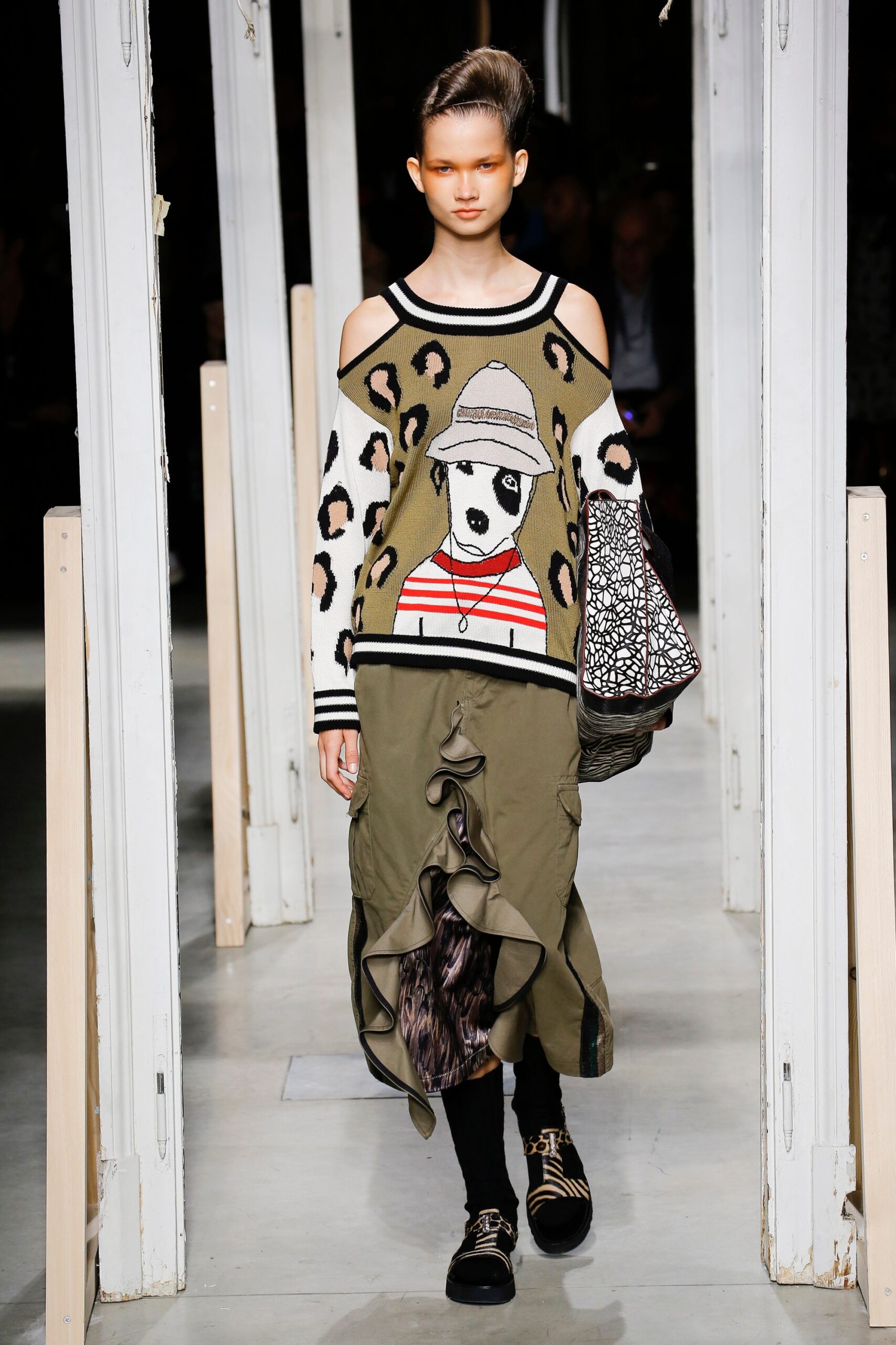 relaxed printed sweater and ruffled skirt
