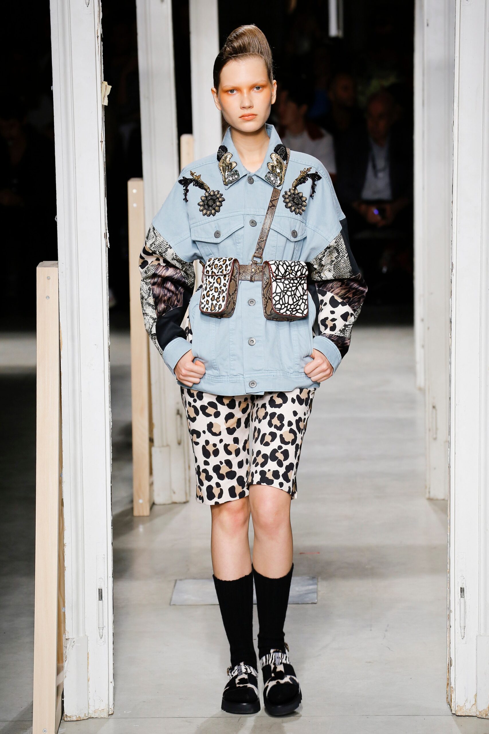 blue denim jacket with animal-print shorts