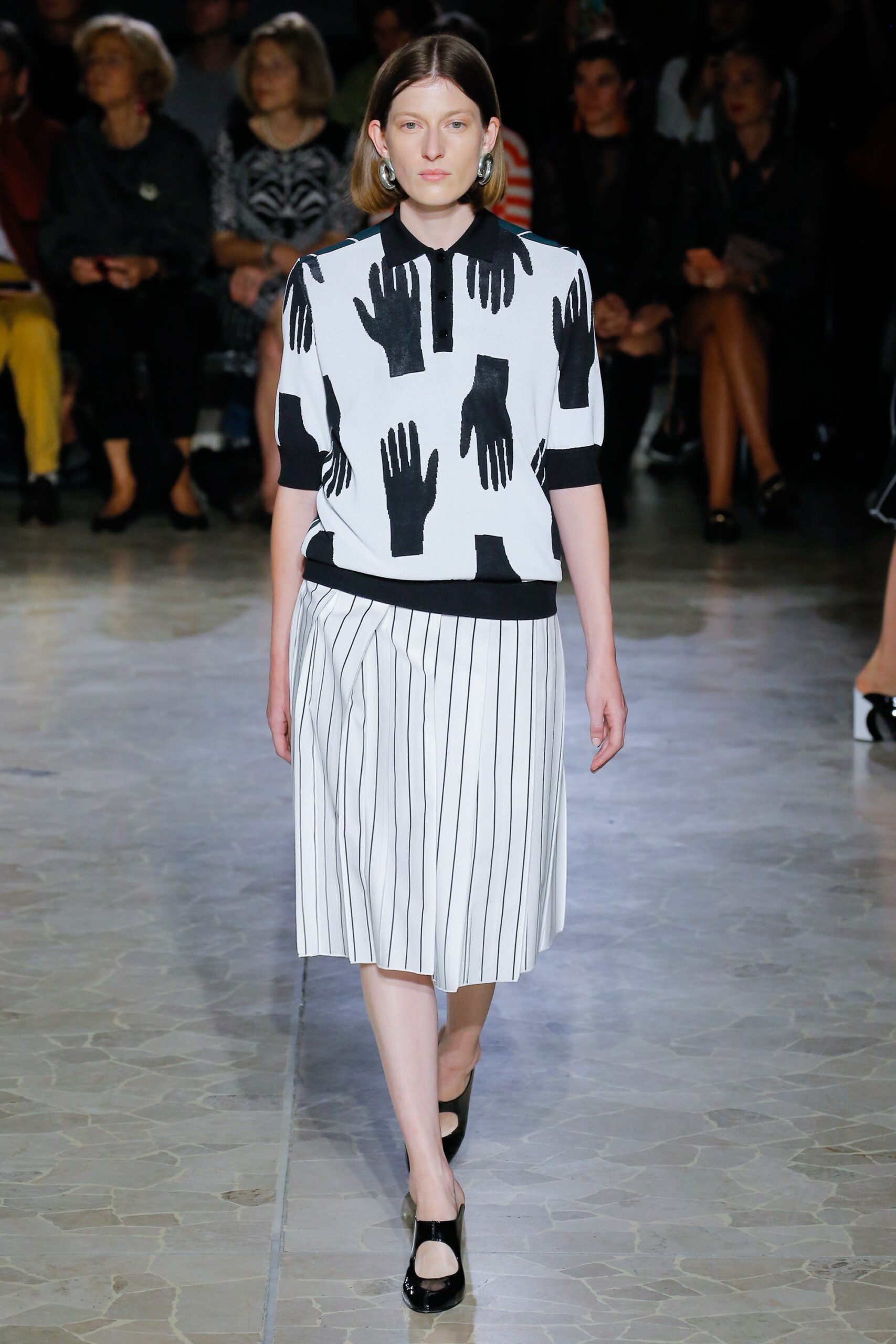 black and white printed top with pleated skirt