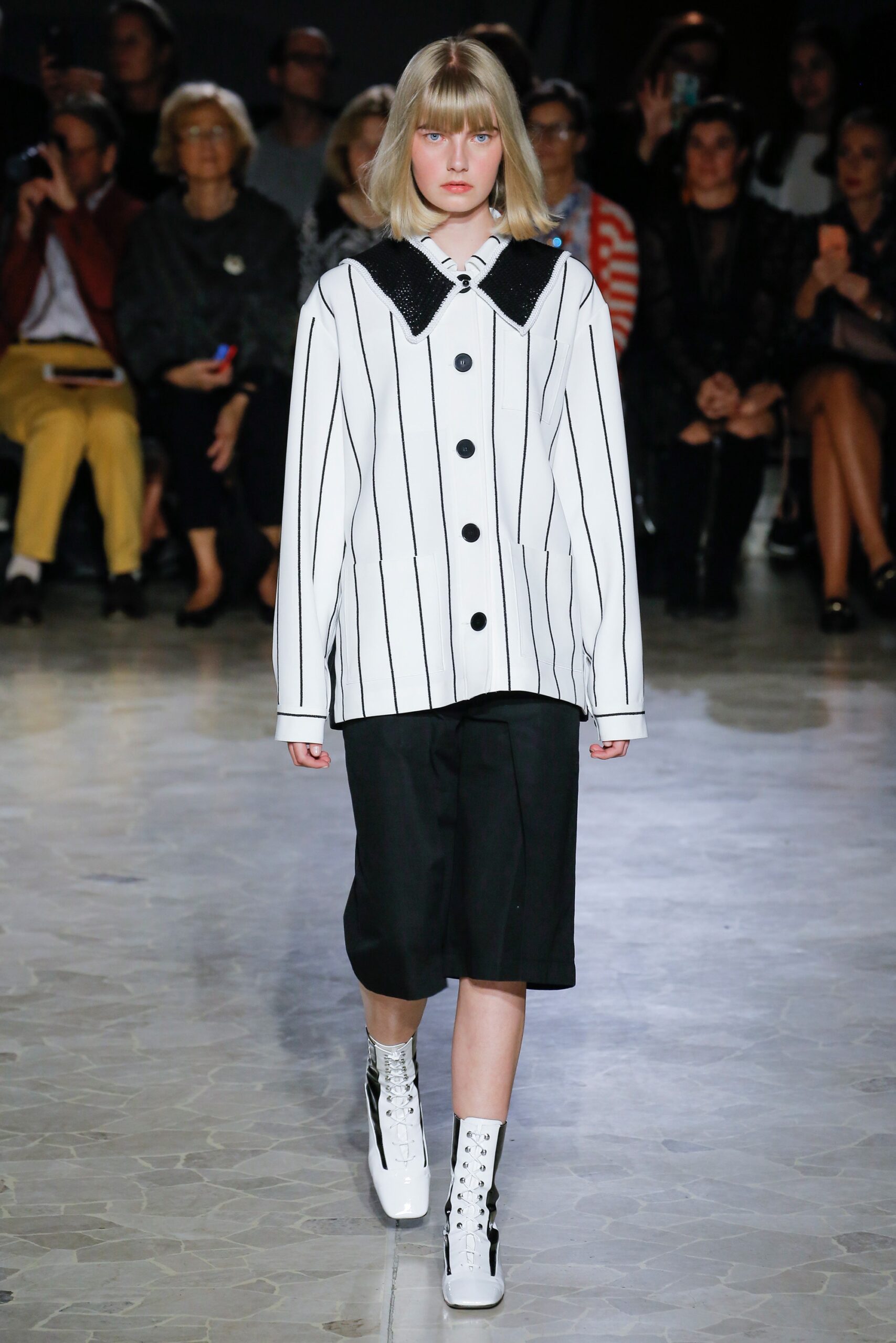 white striped relaxed jacket with black shorts