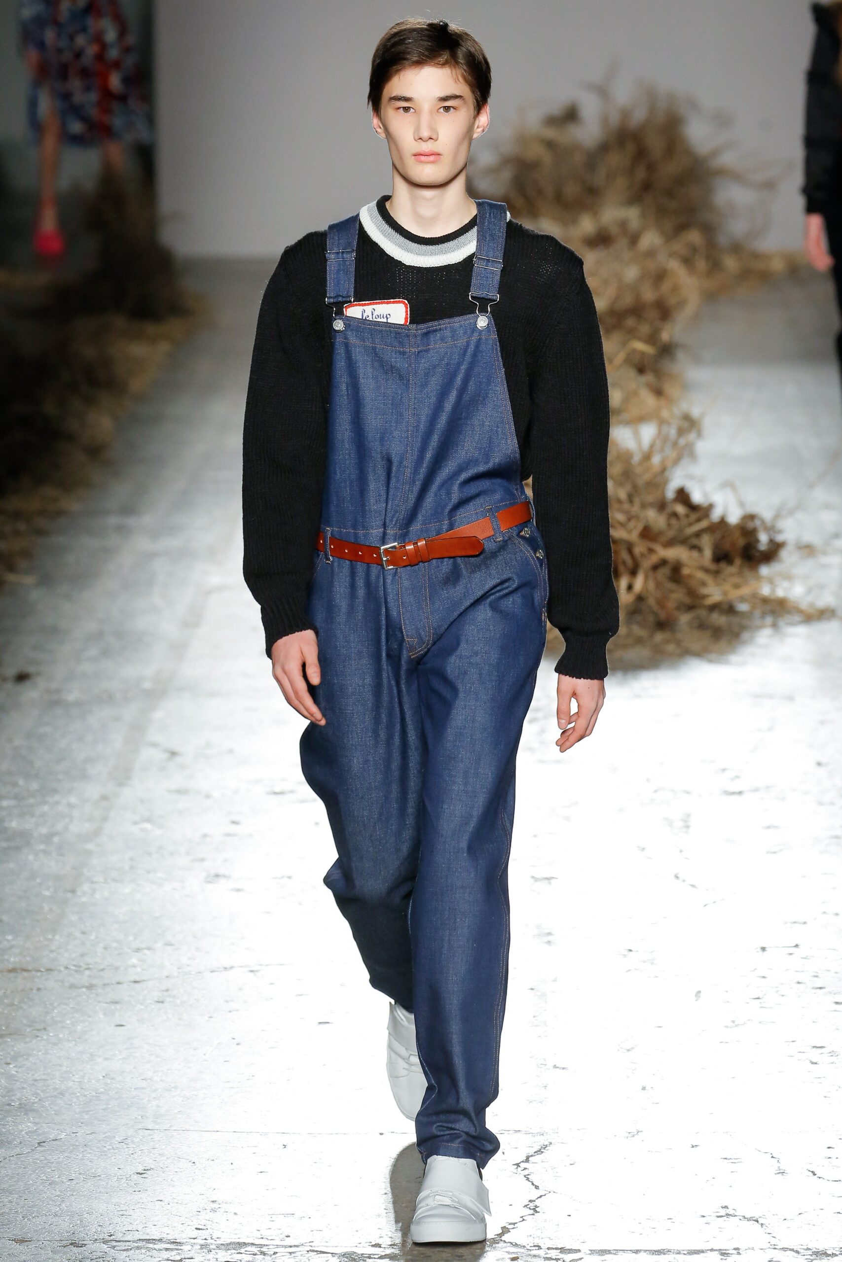 blue denim overalls with black sweater