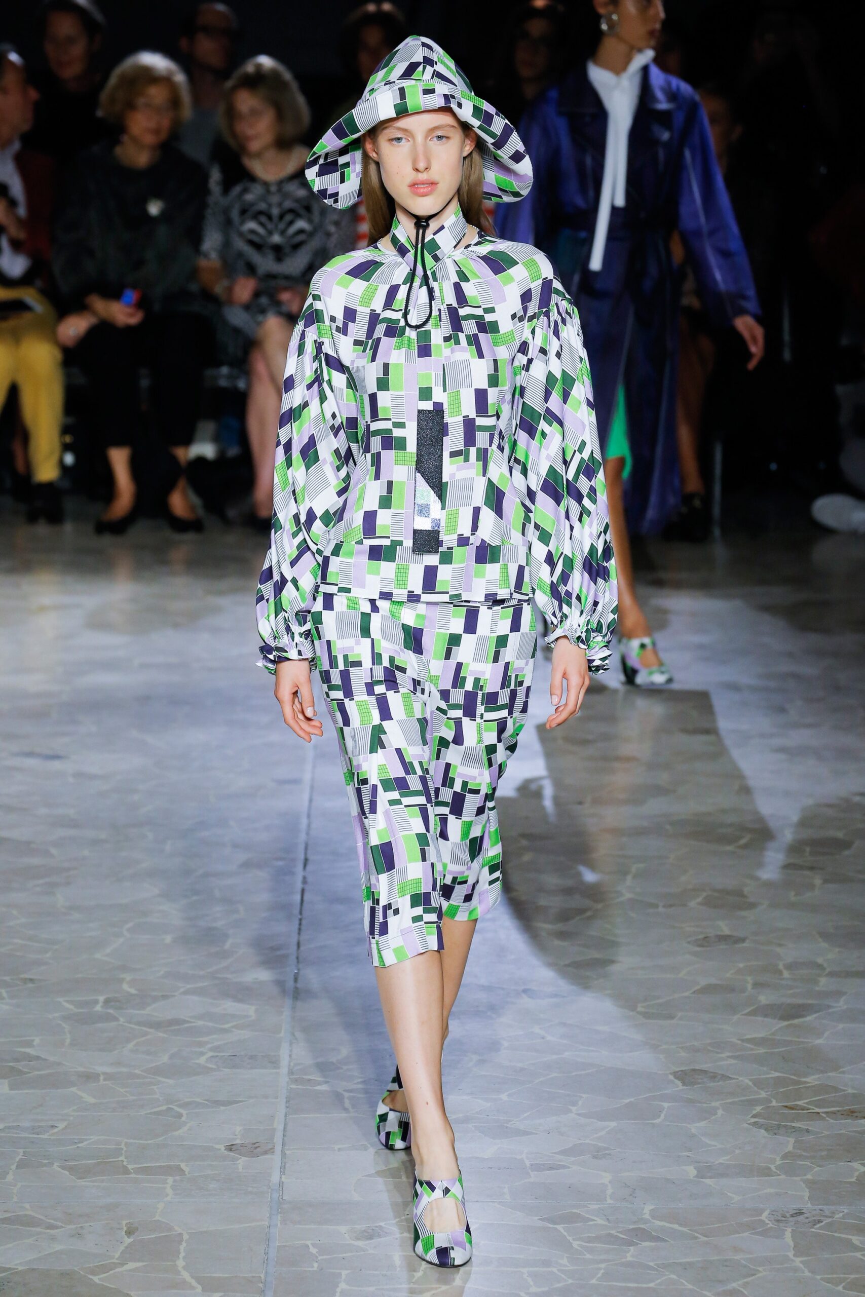 color-blocked purple and green outfit