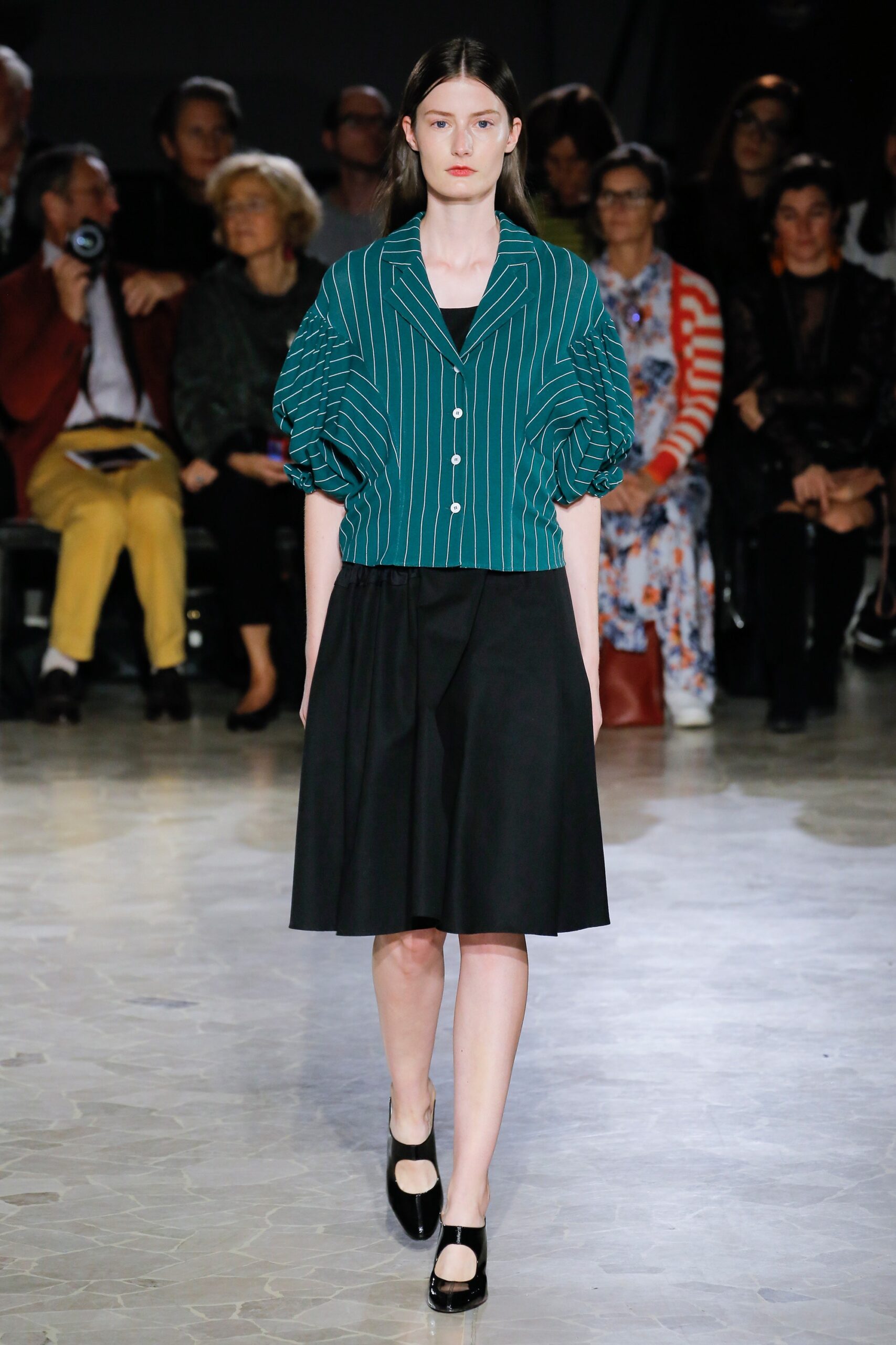 green striped blouse and black skirt