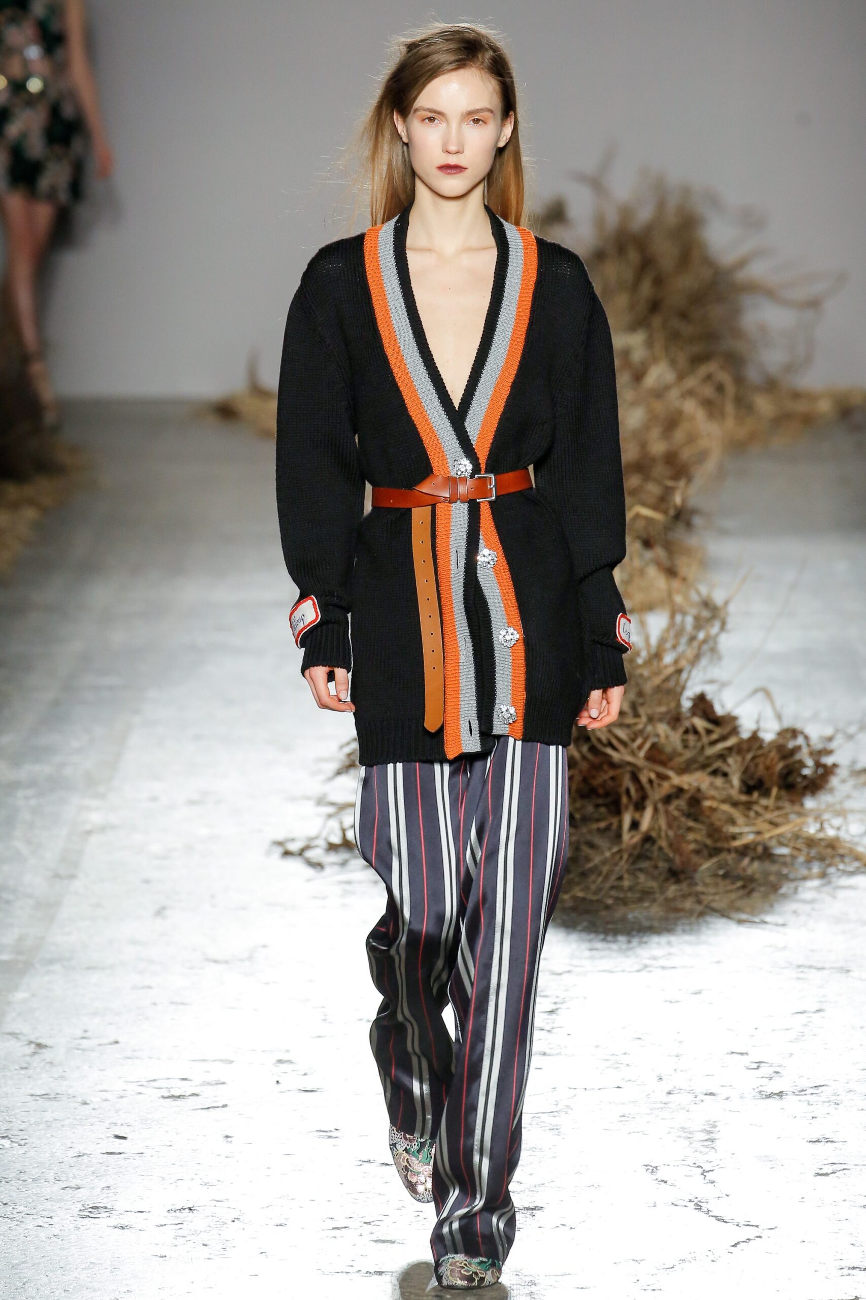 black wool cardigan with striped pants