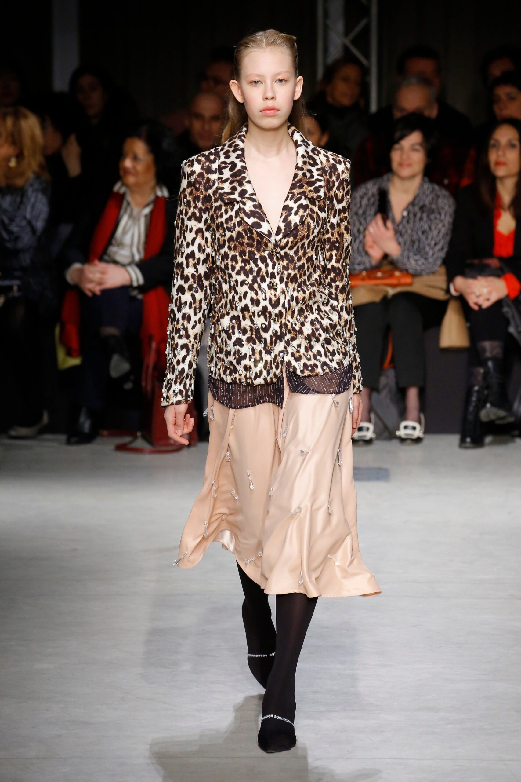 animal-print blazer and pleated dress