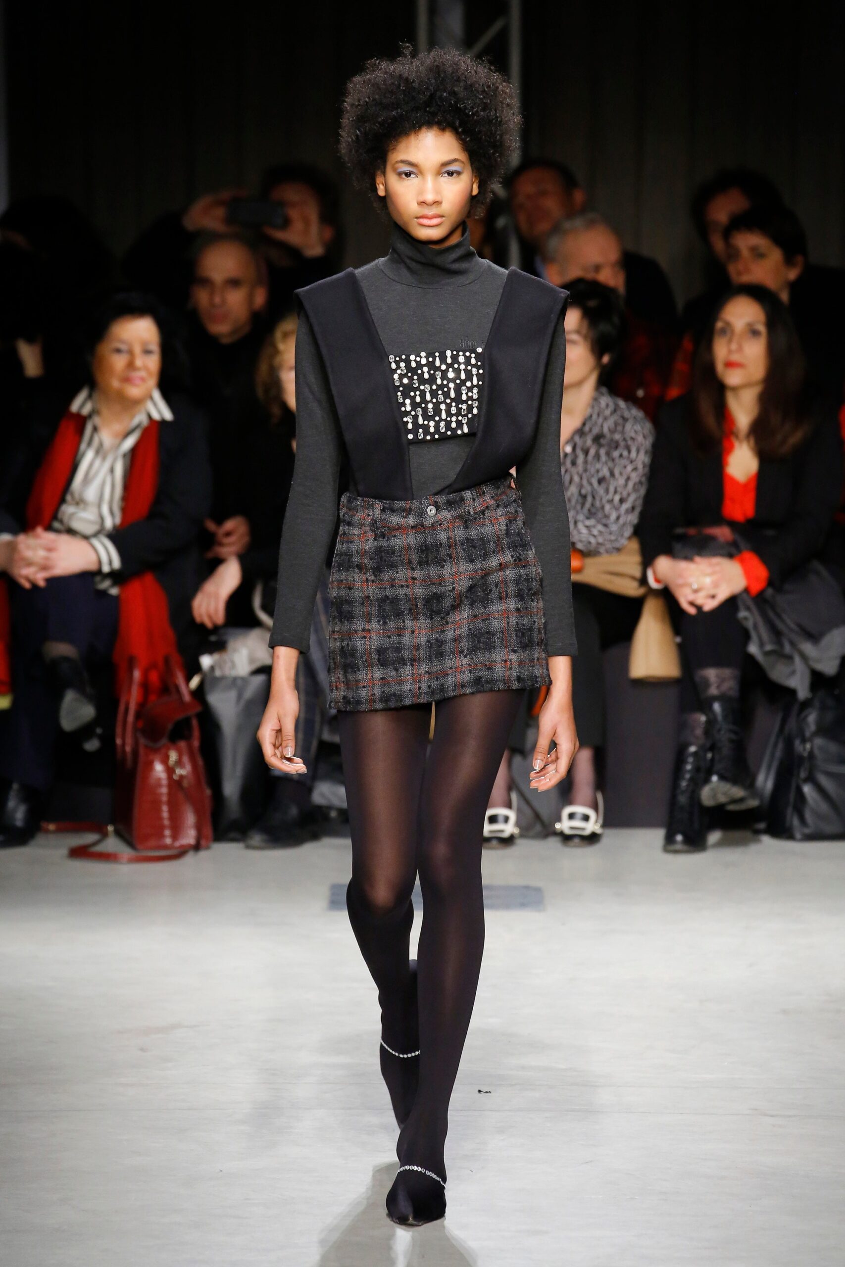 black fitted top with gray skirt