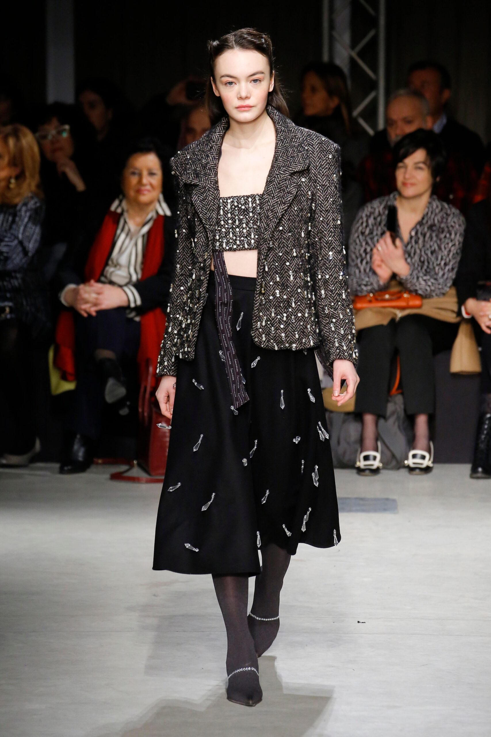 black beaded jacket with crop-top and midi skirt