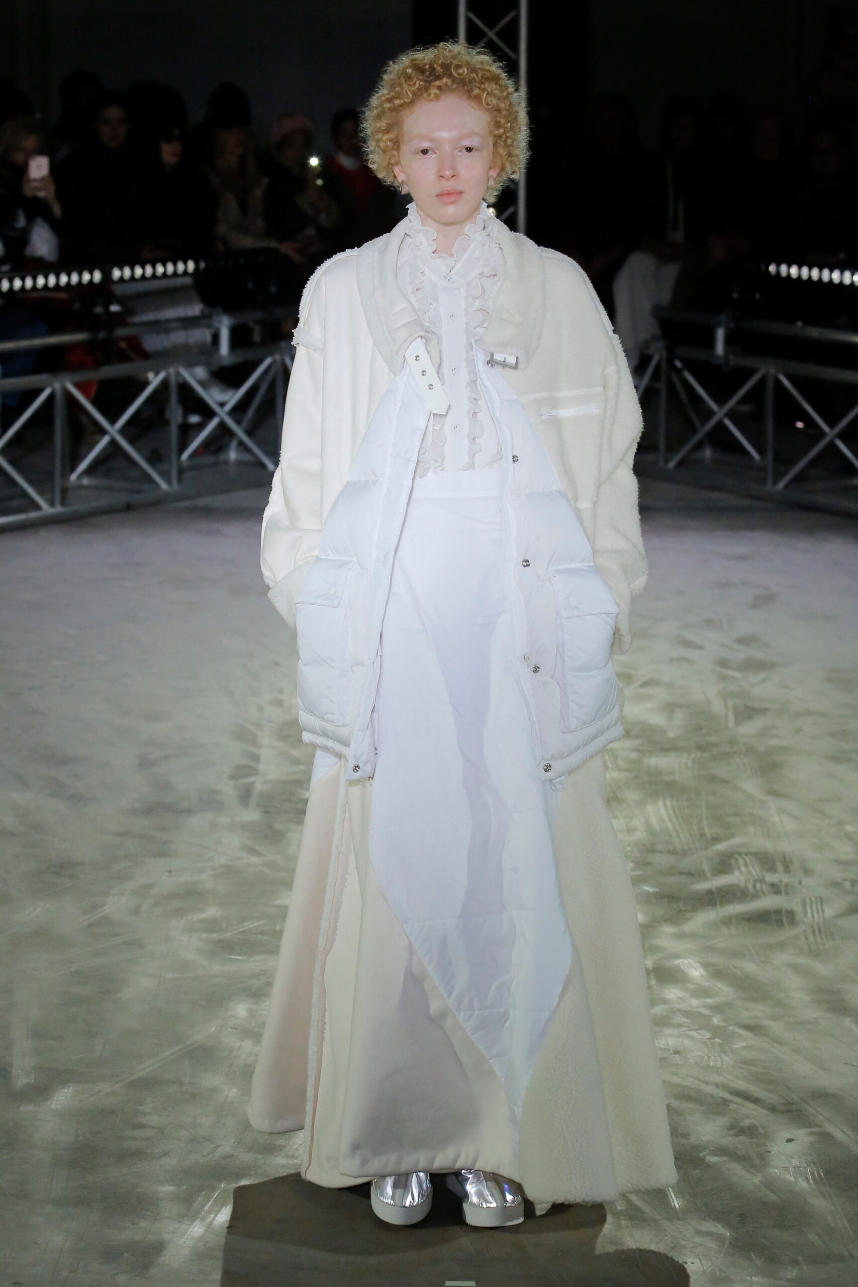 white oversized coat and fitted dress