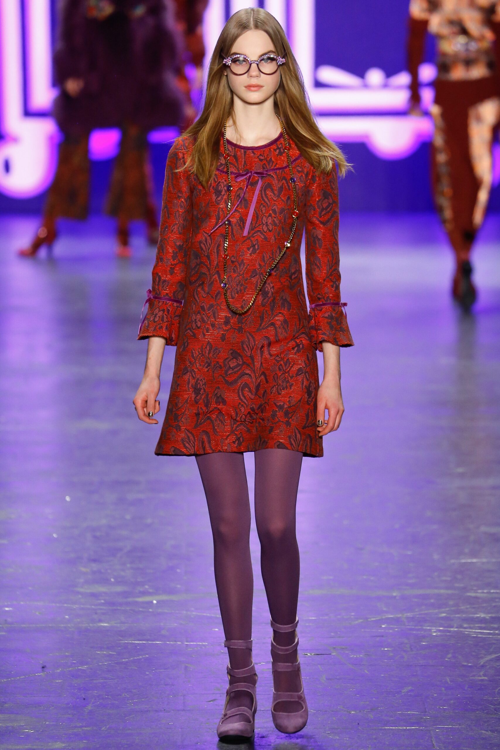 red printed short dress with purple tights