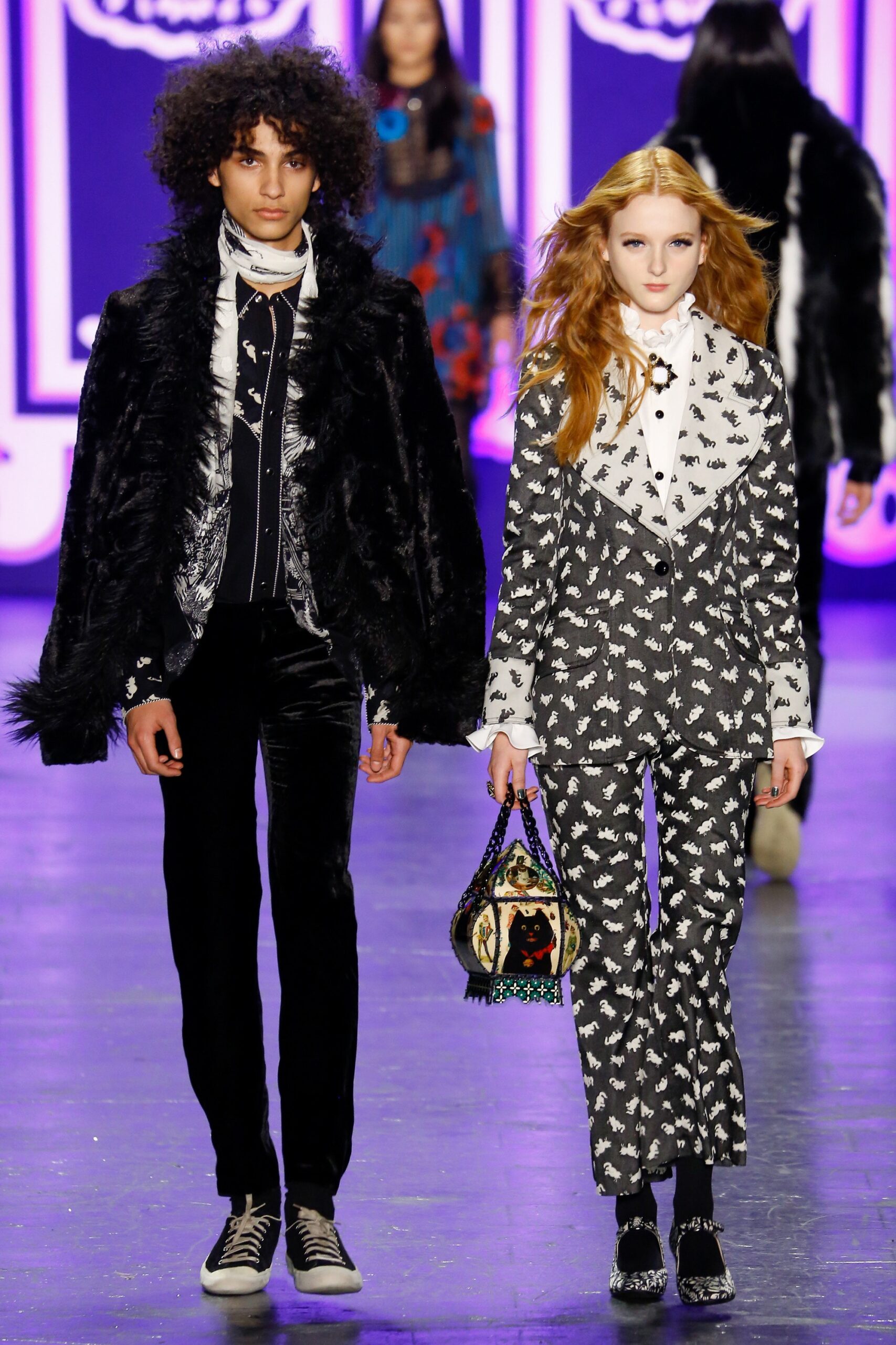black fur oversized coat and gray tailored blazer