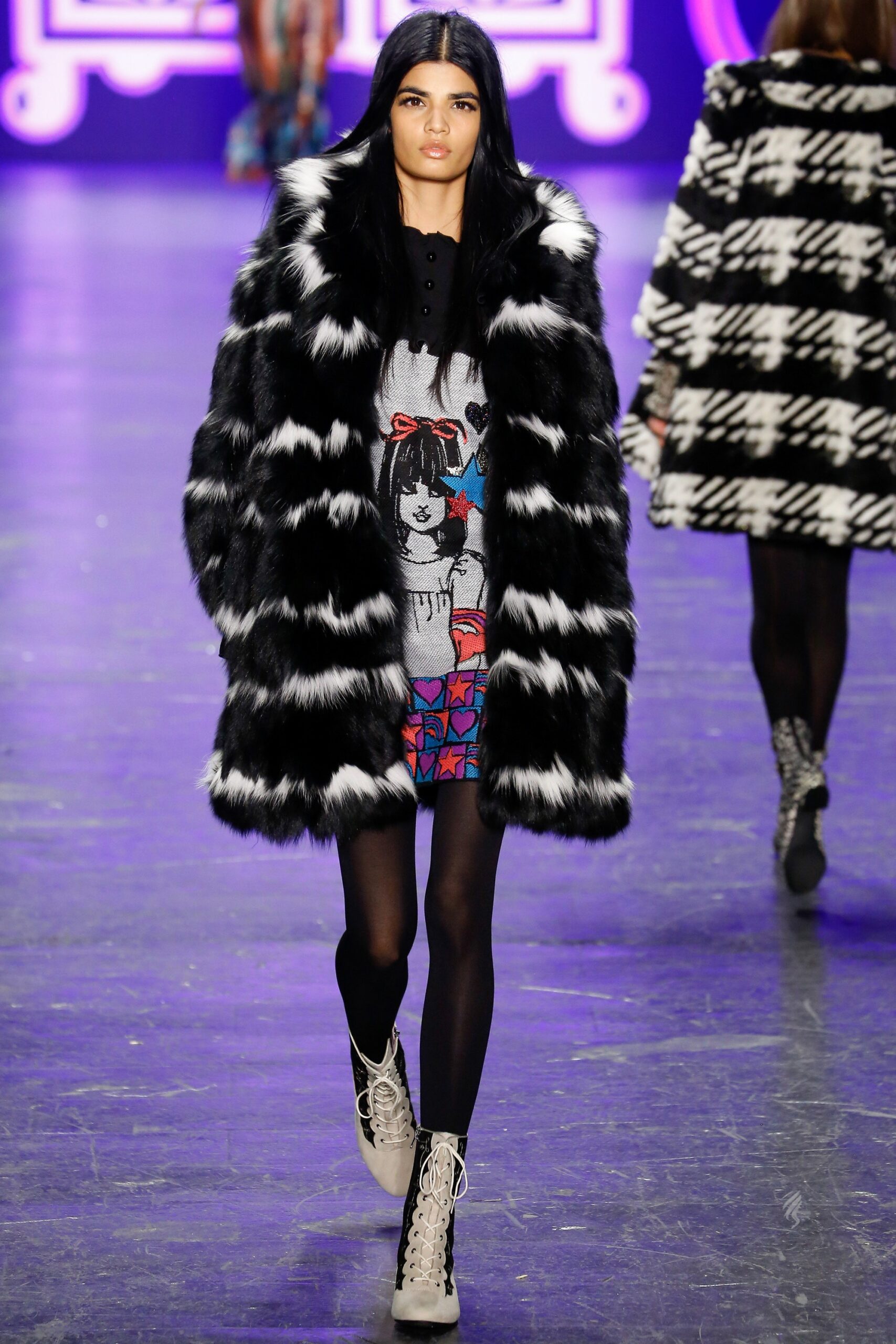 black and white faux-fur coat with gray printed dress