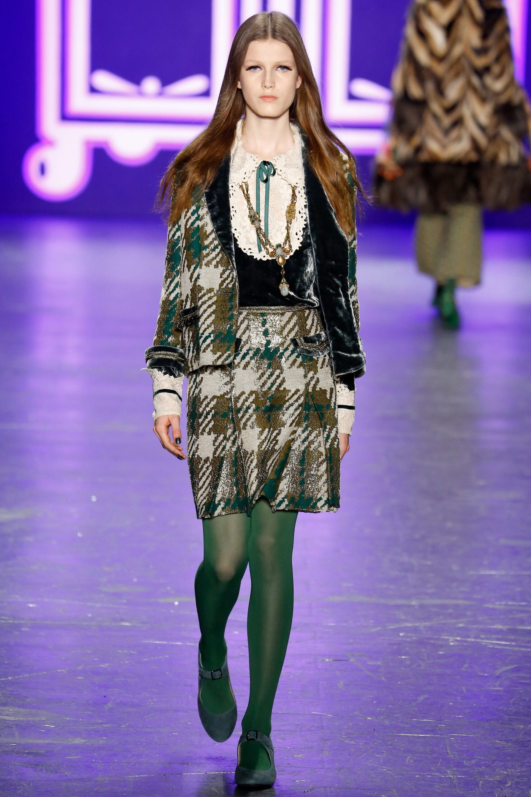 fitted black velvet blazer with pleated skirt