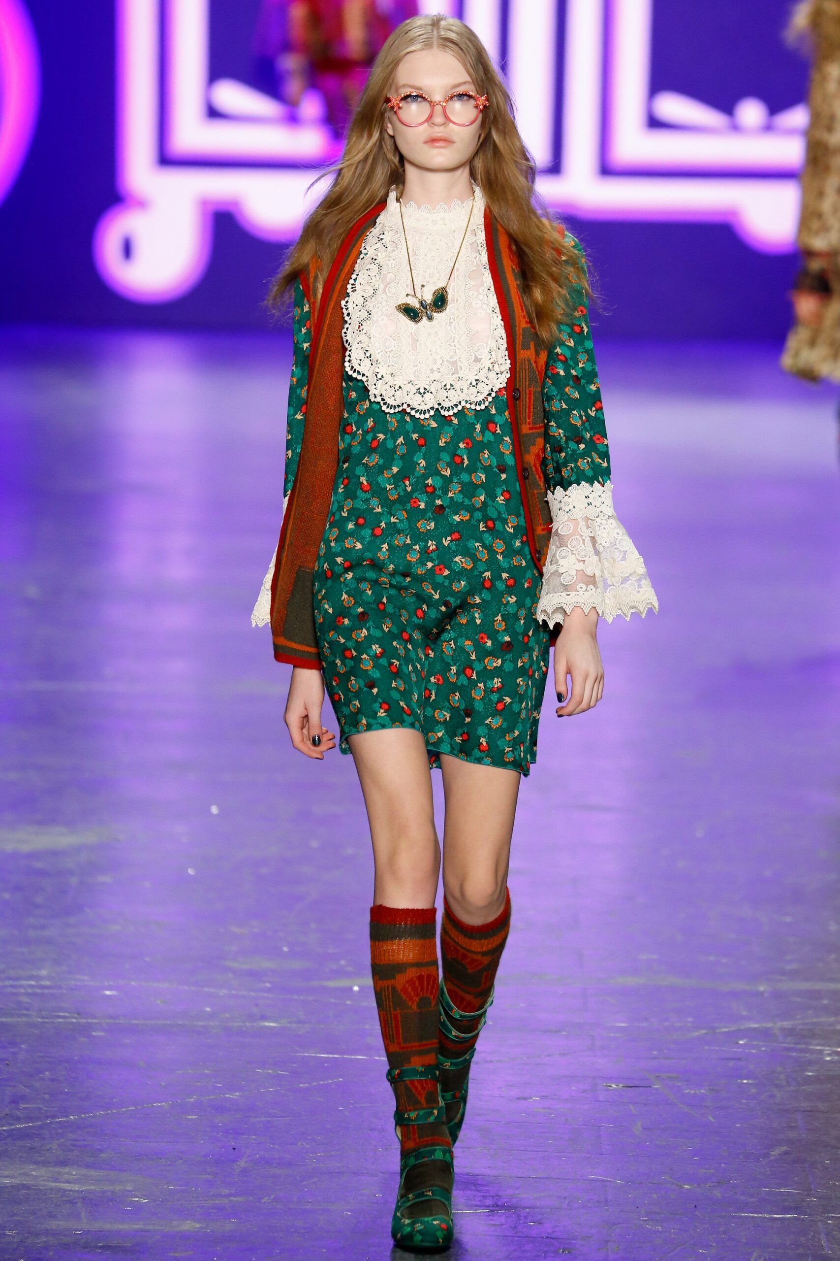 green floral dress with red blazer