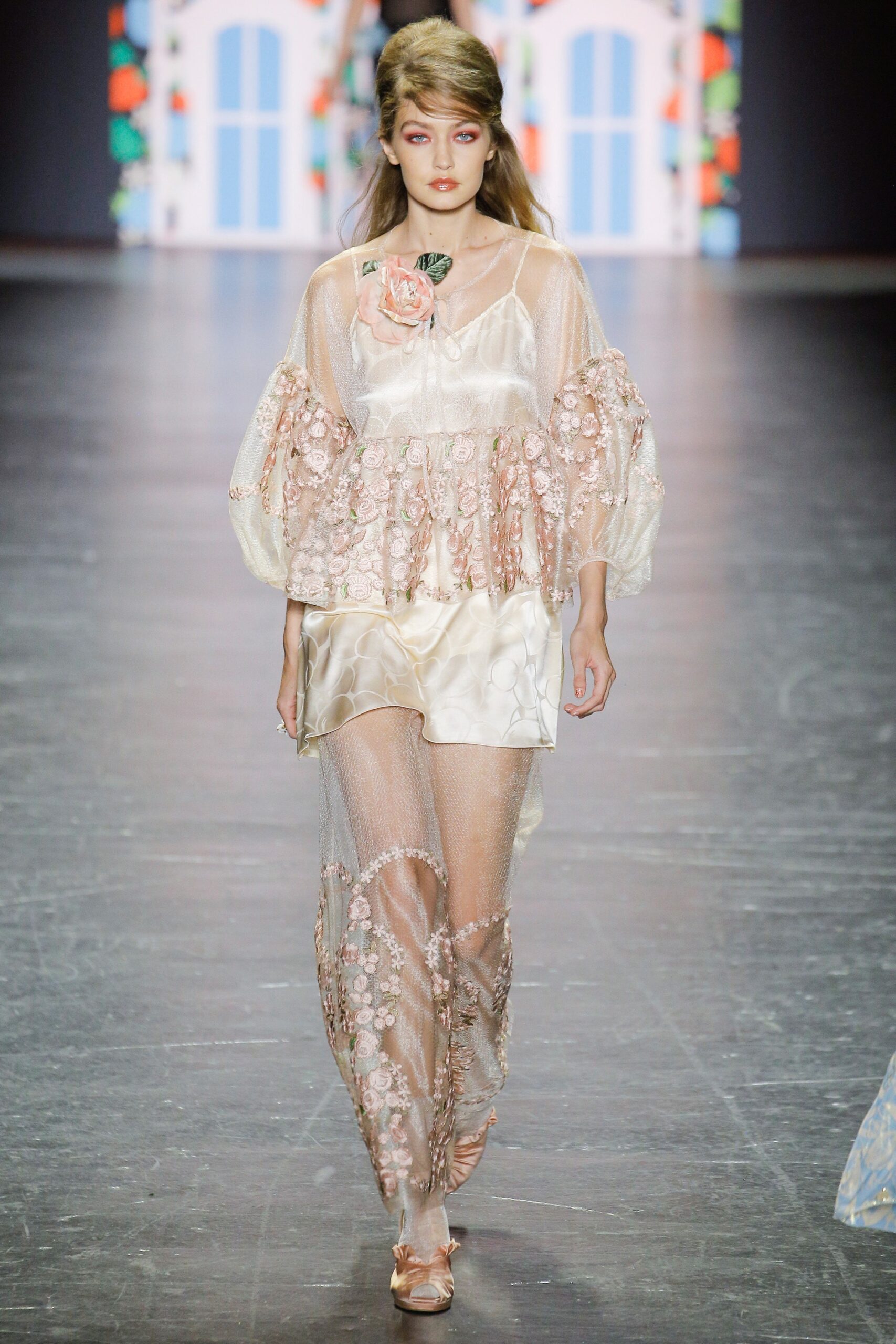 pink lace top with beige pants