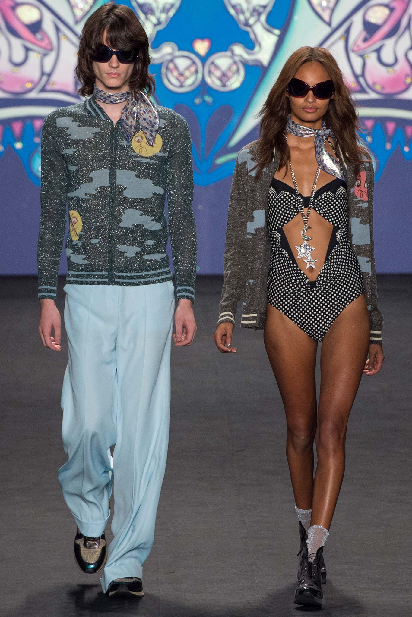 black and white polka-dot bikini with gray cardigan