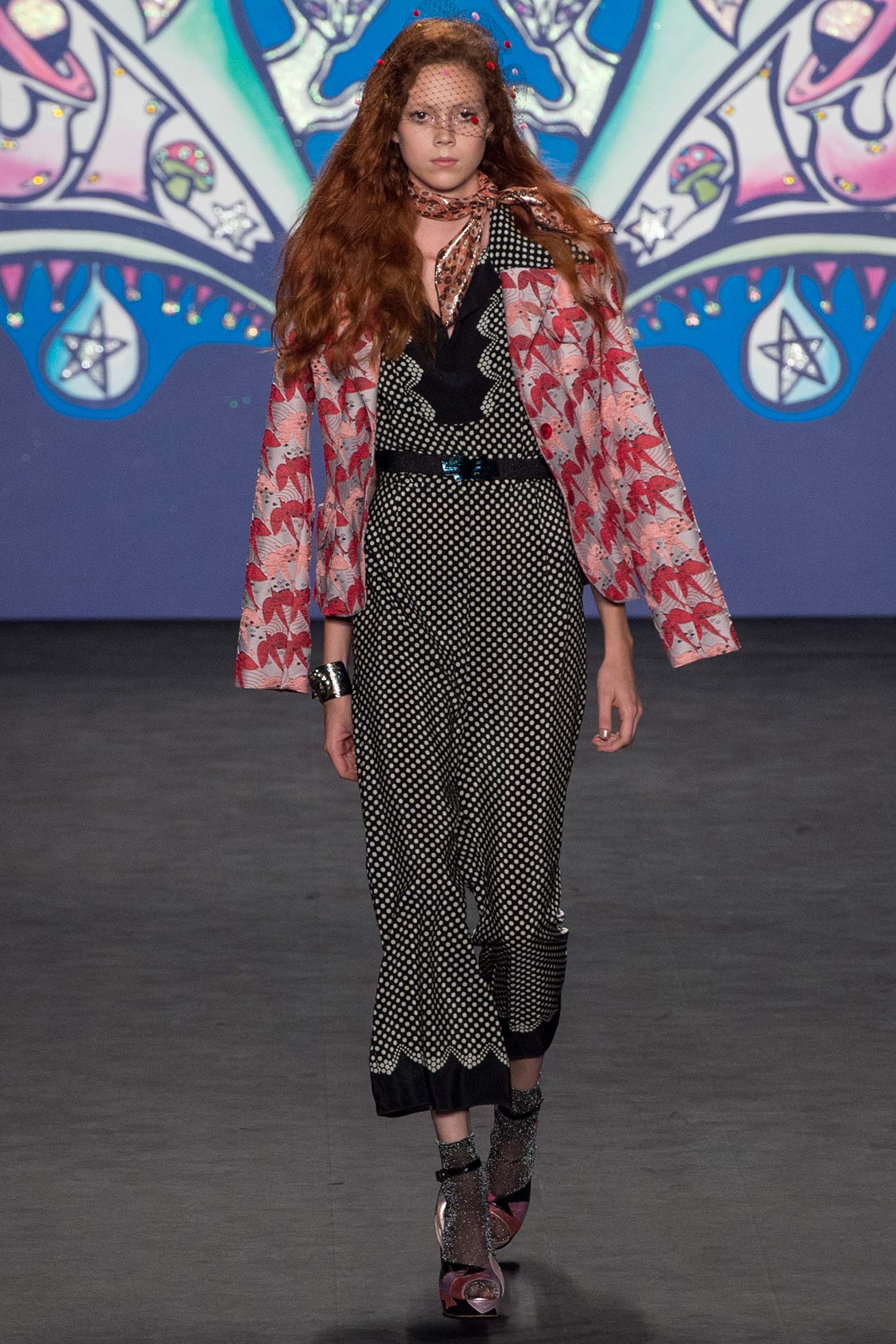 pink floral jacket and black polka-dot jumpsuit