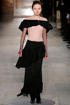 pink off-shoulder top with black layered skirt