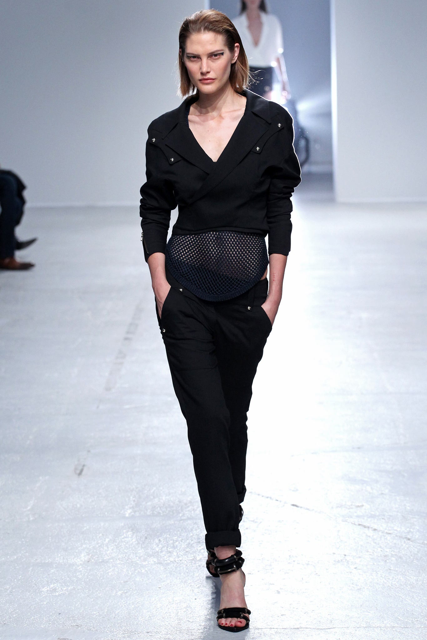 black fitted jumpsuit with strappy shoes