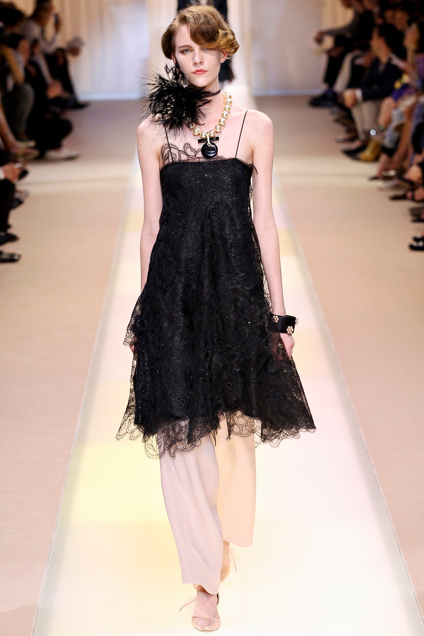 black lace mini dress with beige pants