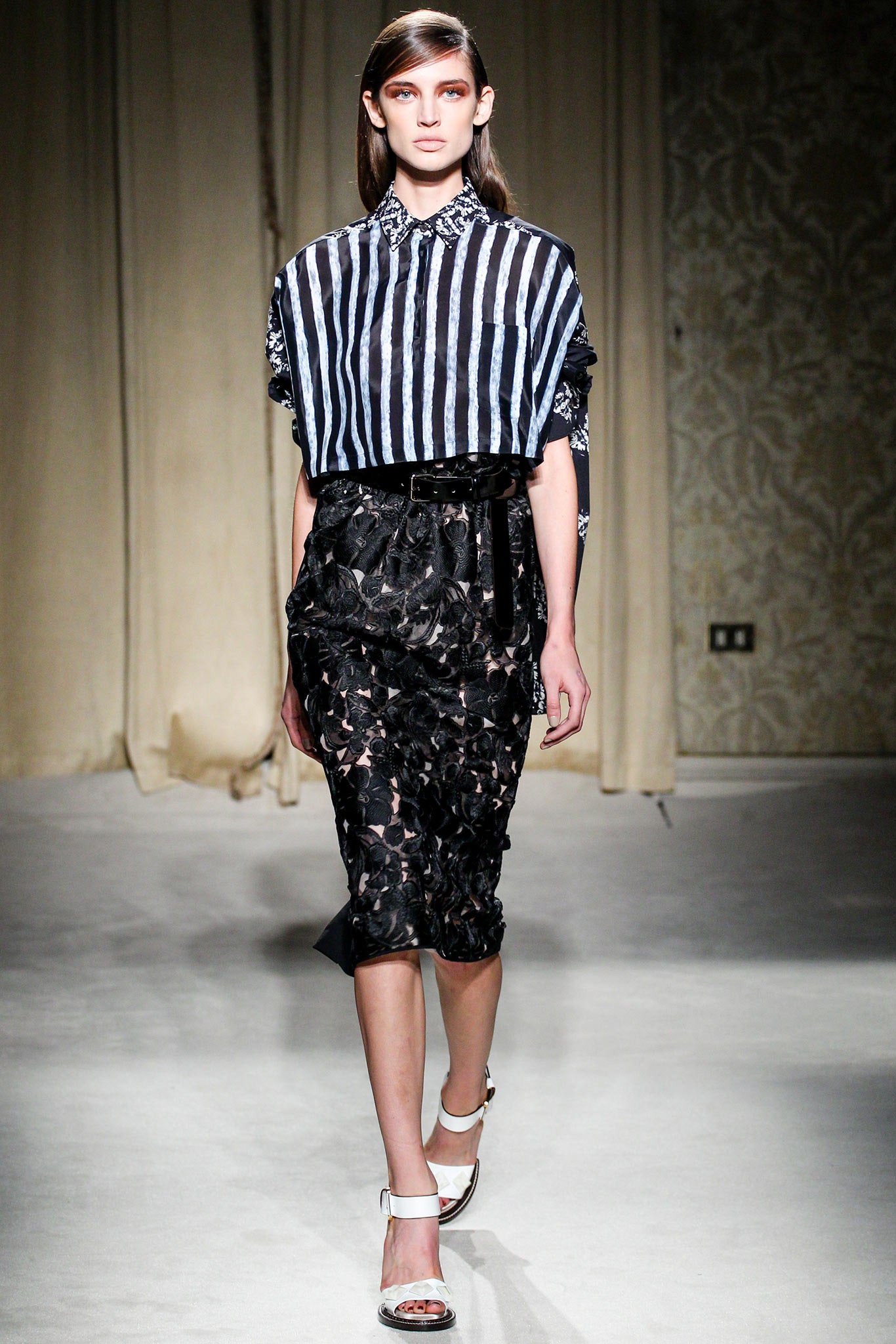 relaxed striped shirt and fitted black skirt