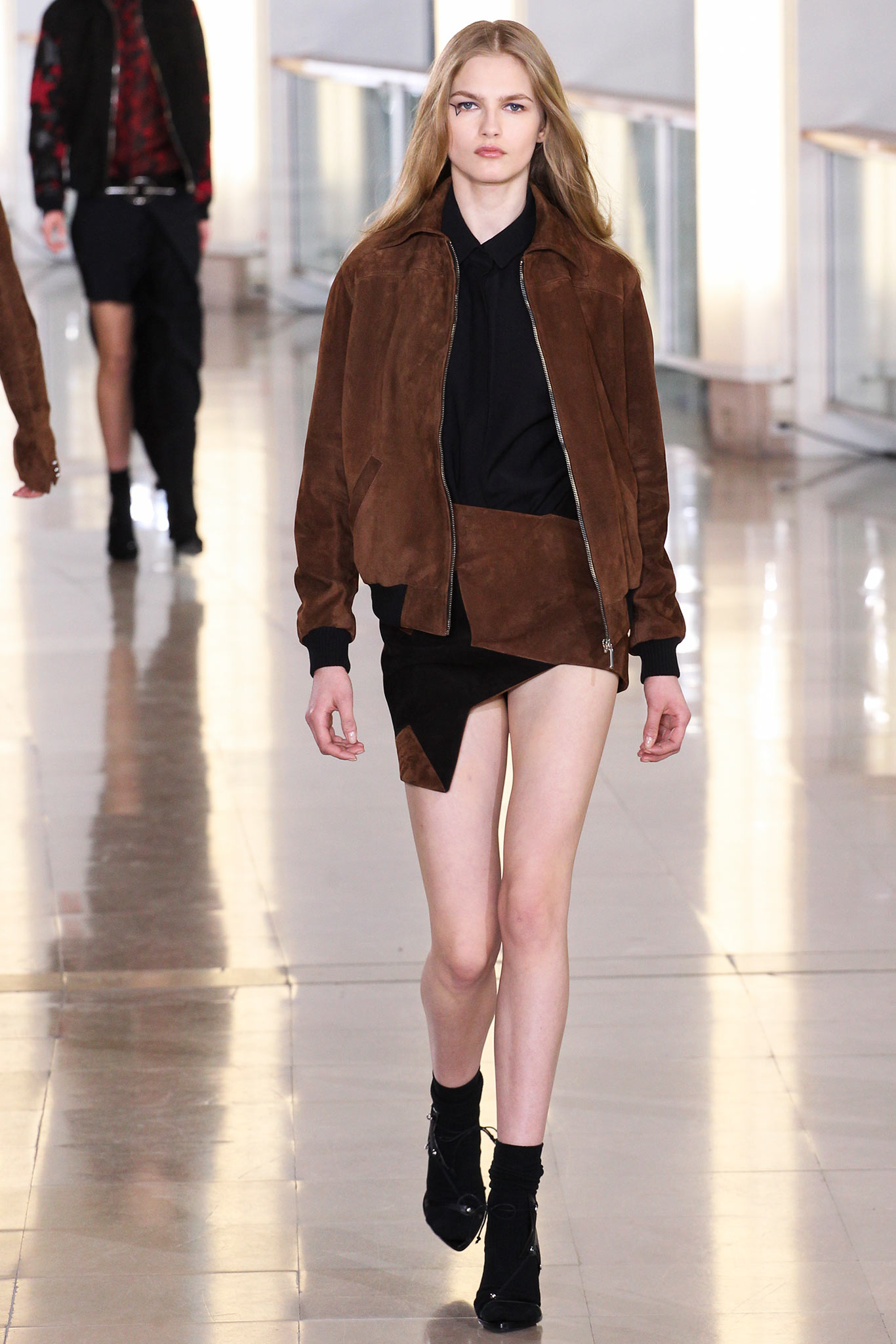 brown suede fitted jacket with black top and mini skirt