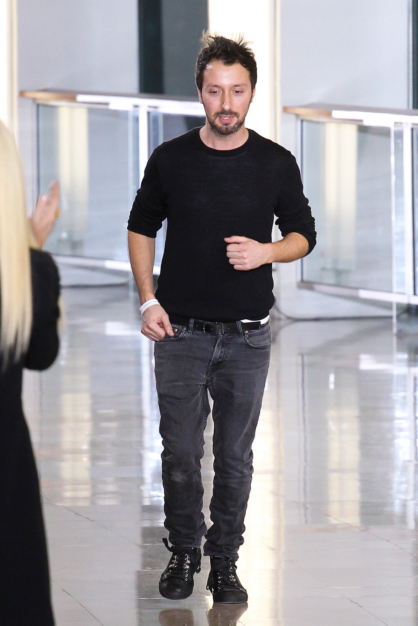 black sweater gray pants