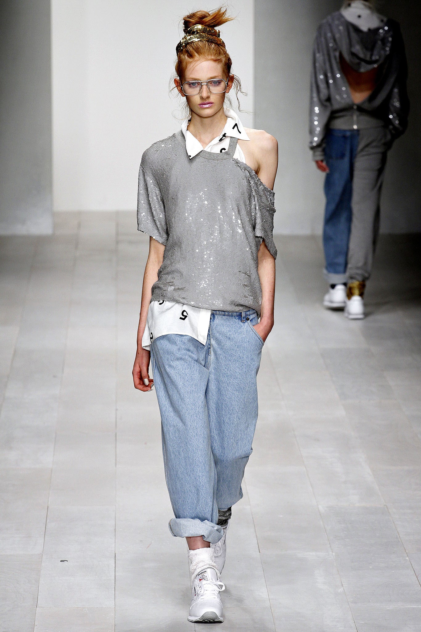 gray sequin off-shoulder top with denim pants