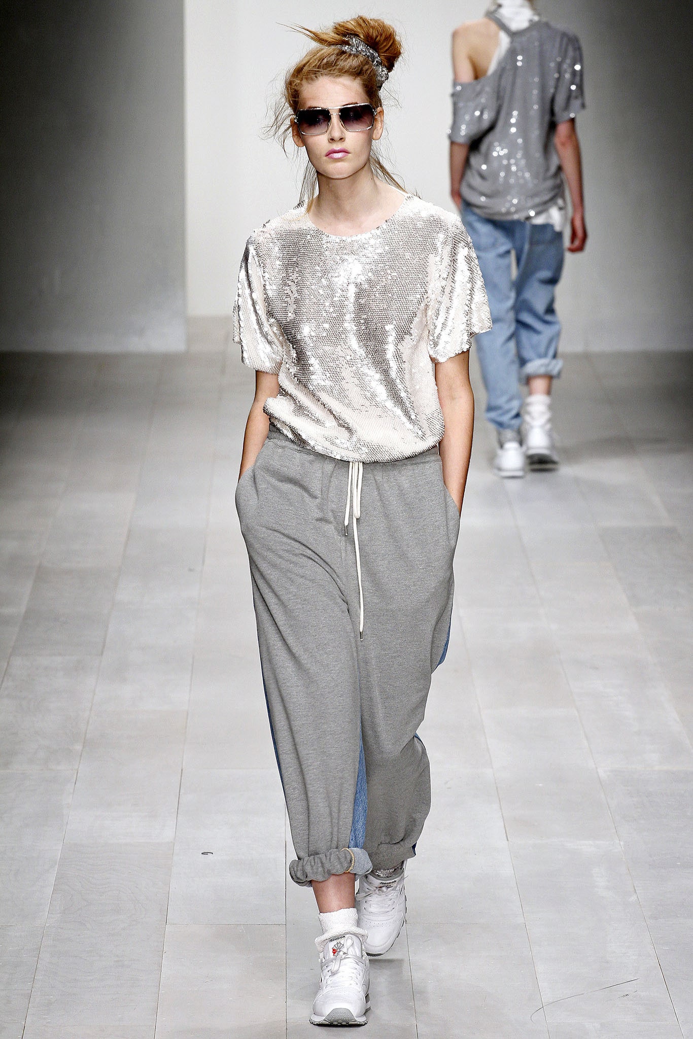shiny silver sequin top and gray pants
