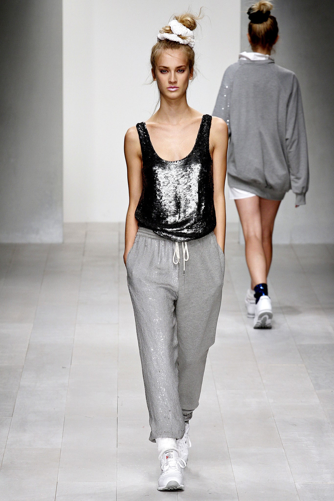 silver sequin tank-top and gray pants