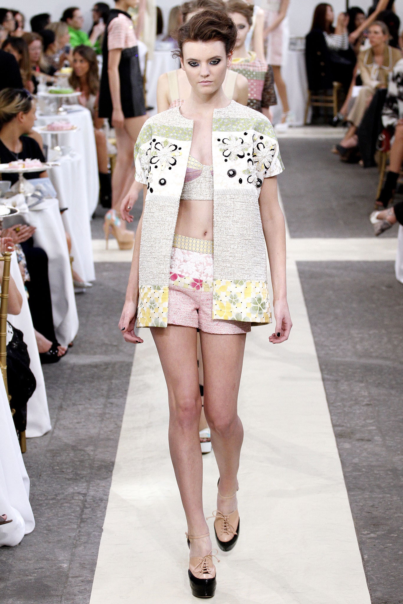 white embroidered jacket with crop-top and shorts