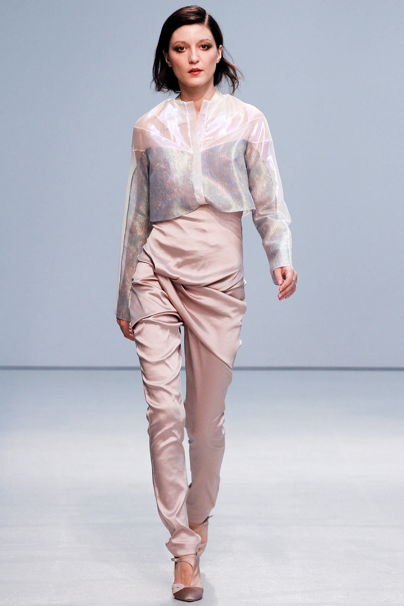 sheer white top with beige pants