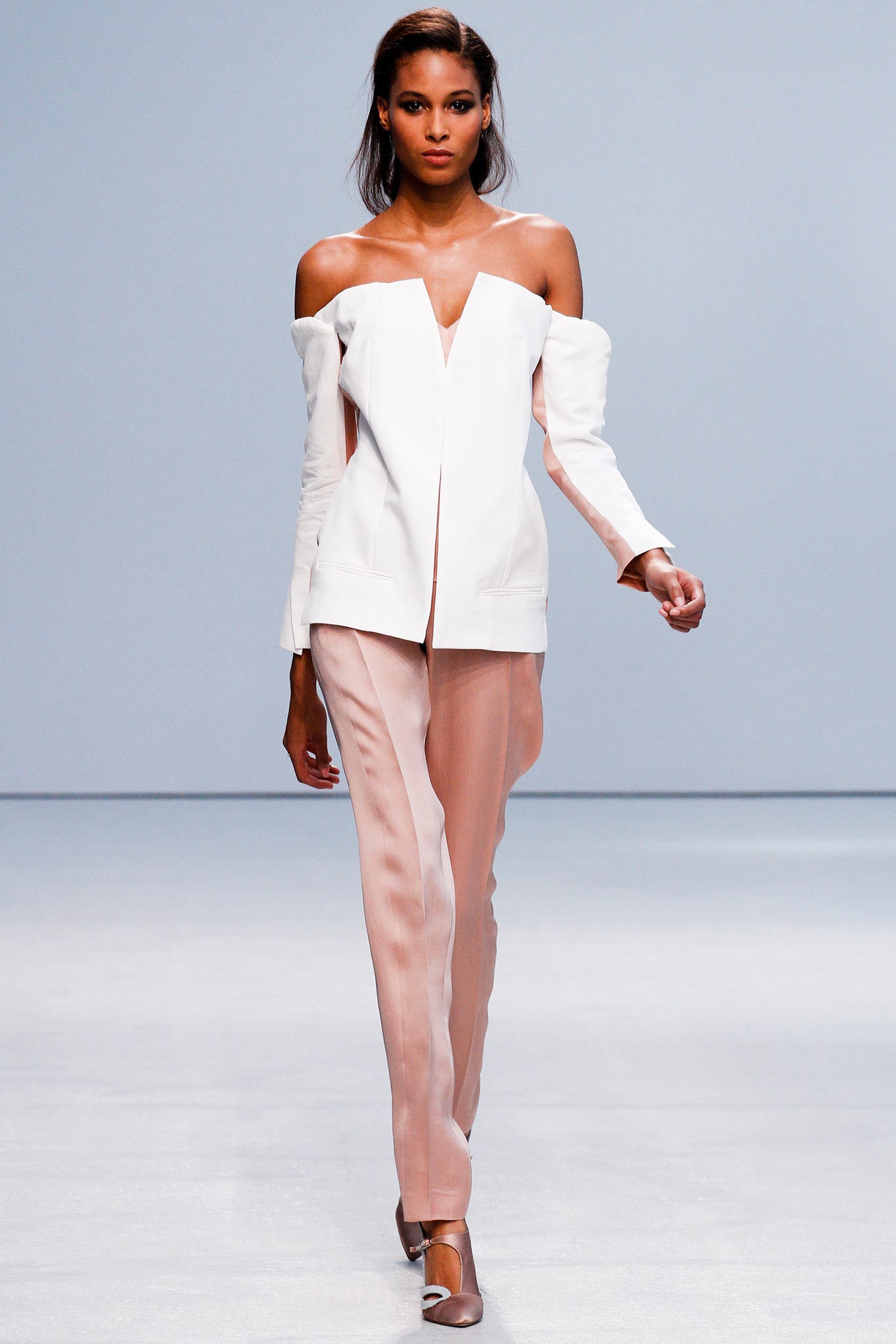 white off-shoulder blazer with beige pants