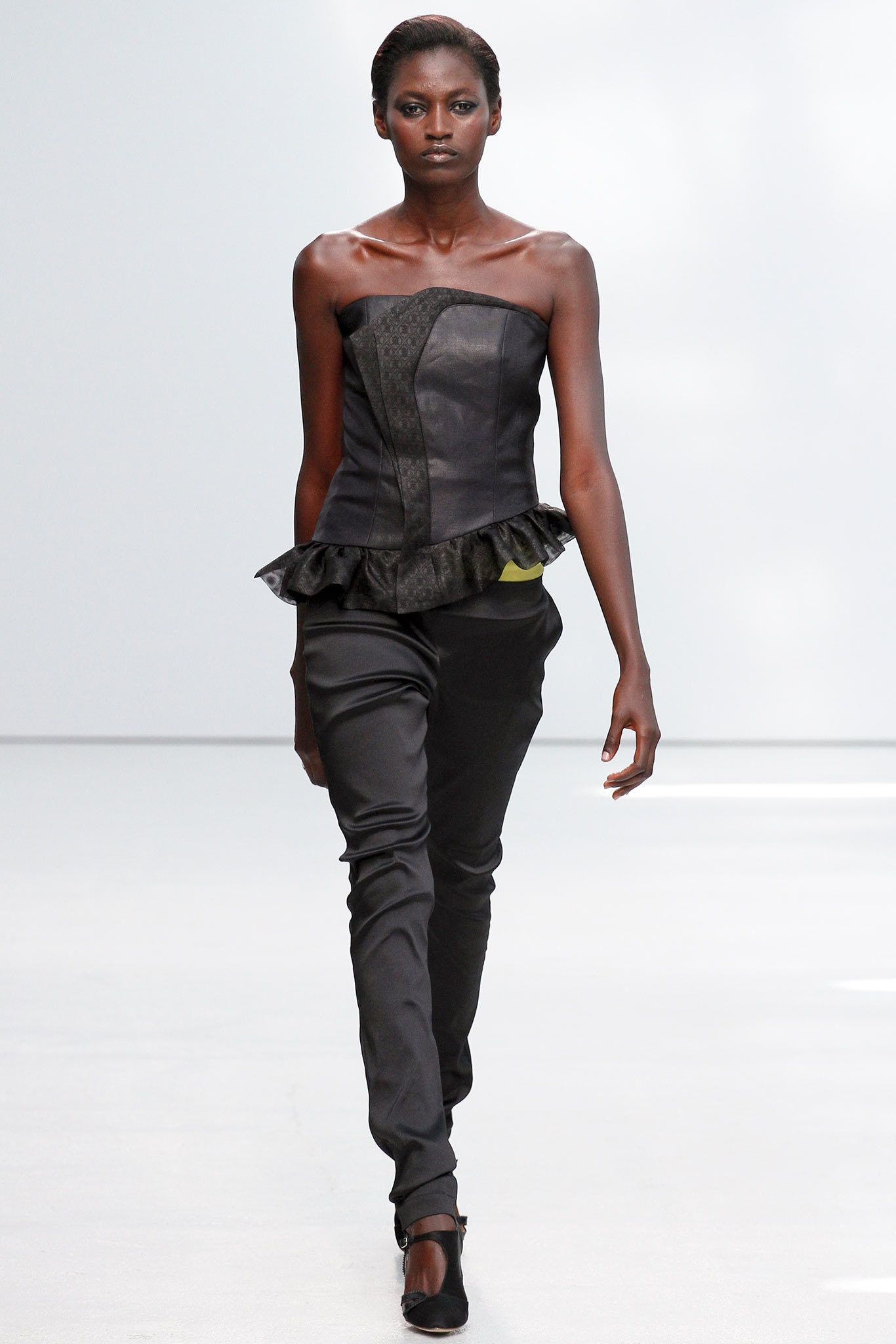 black leather strapless top and slim pants