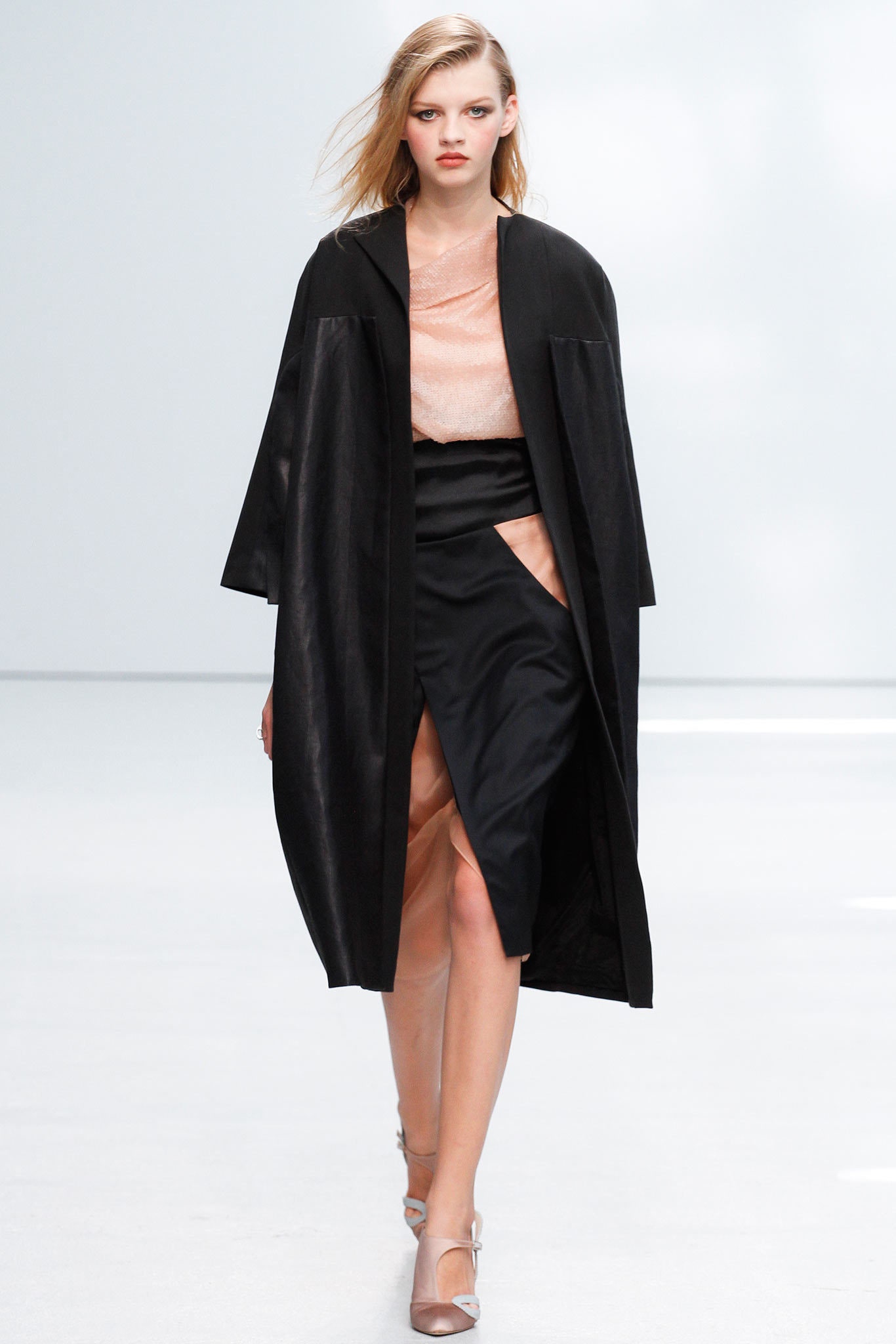 black coat pink top black skirt