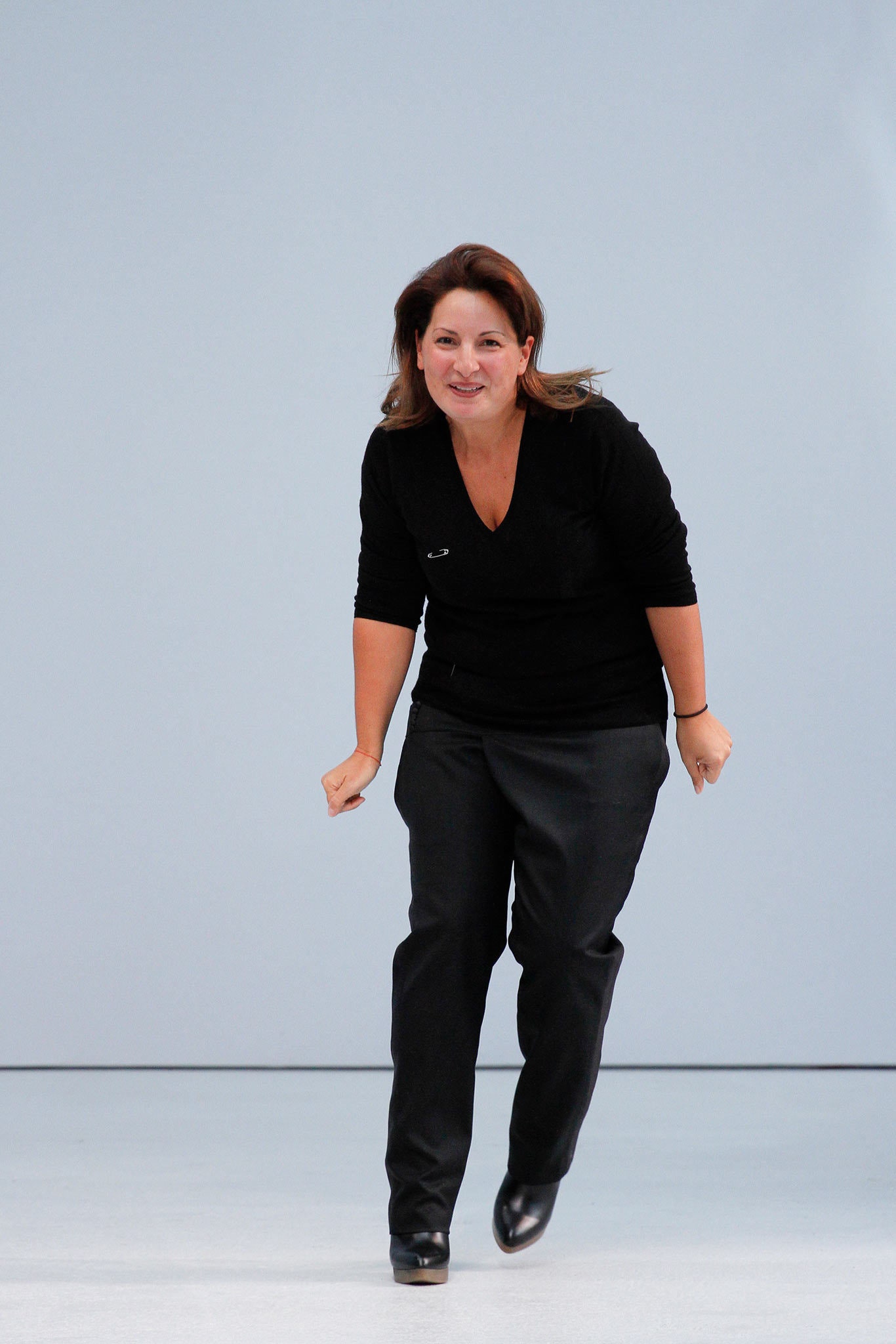 black fitted top and tailored pants