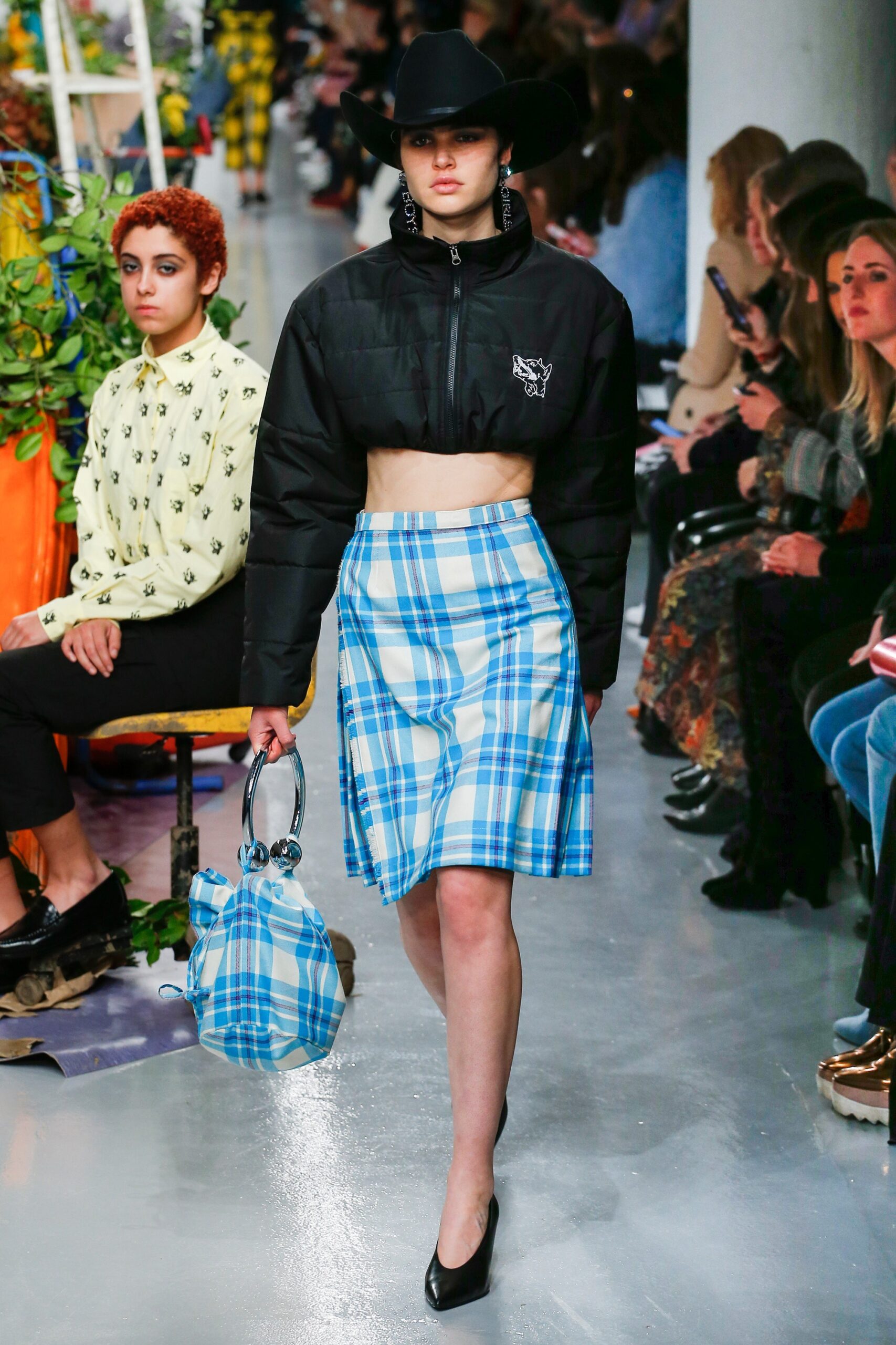 black cropped jacket with blue skirt