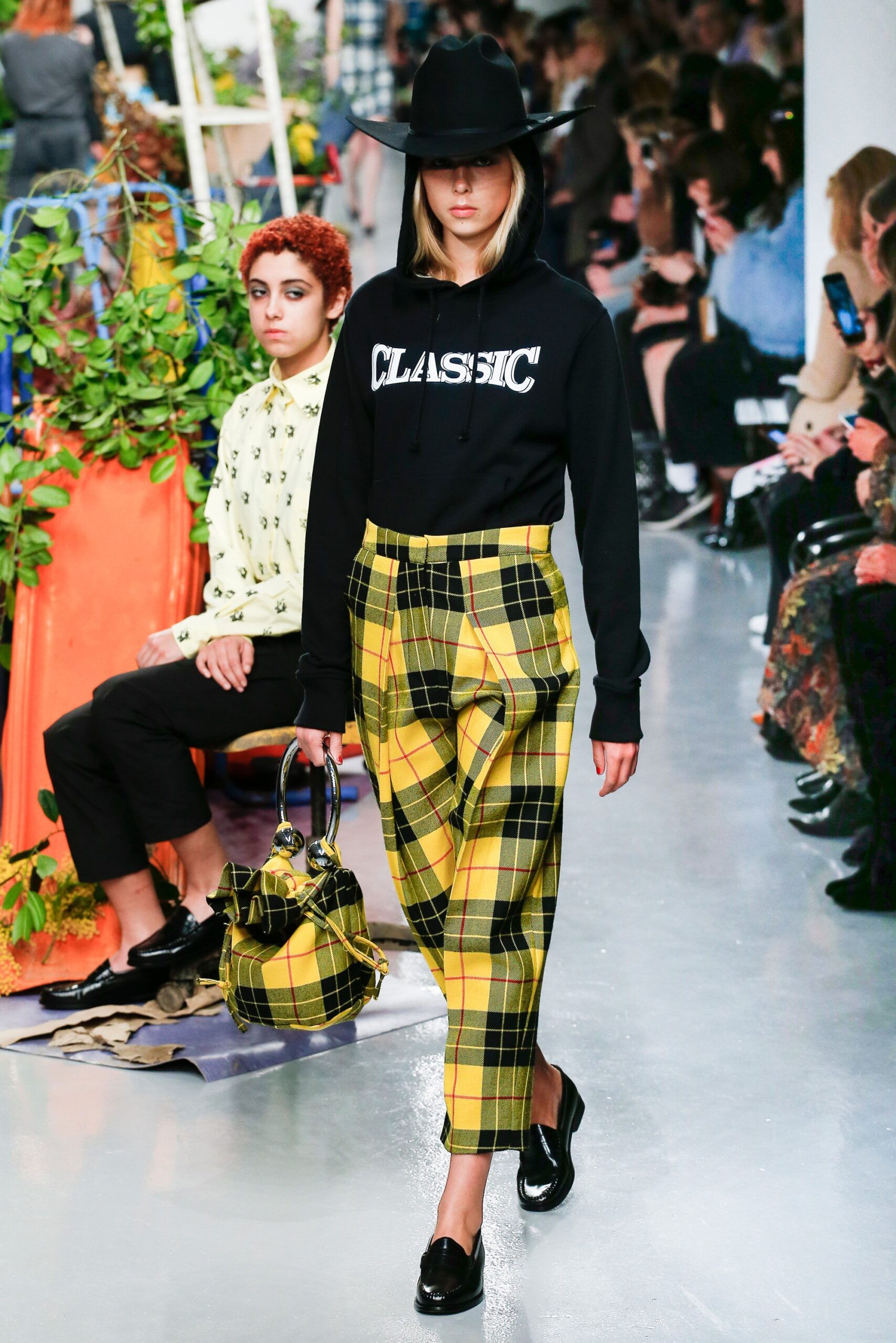 black hoodie and yellow plaid pants