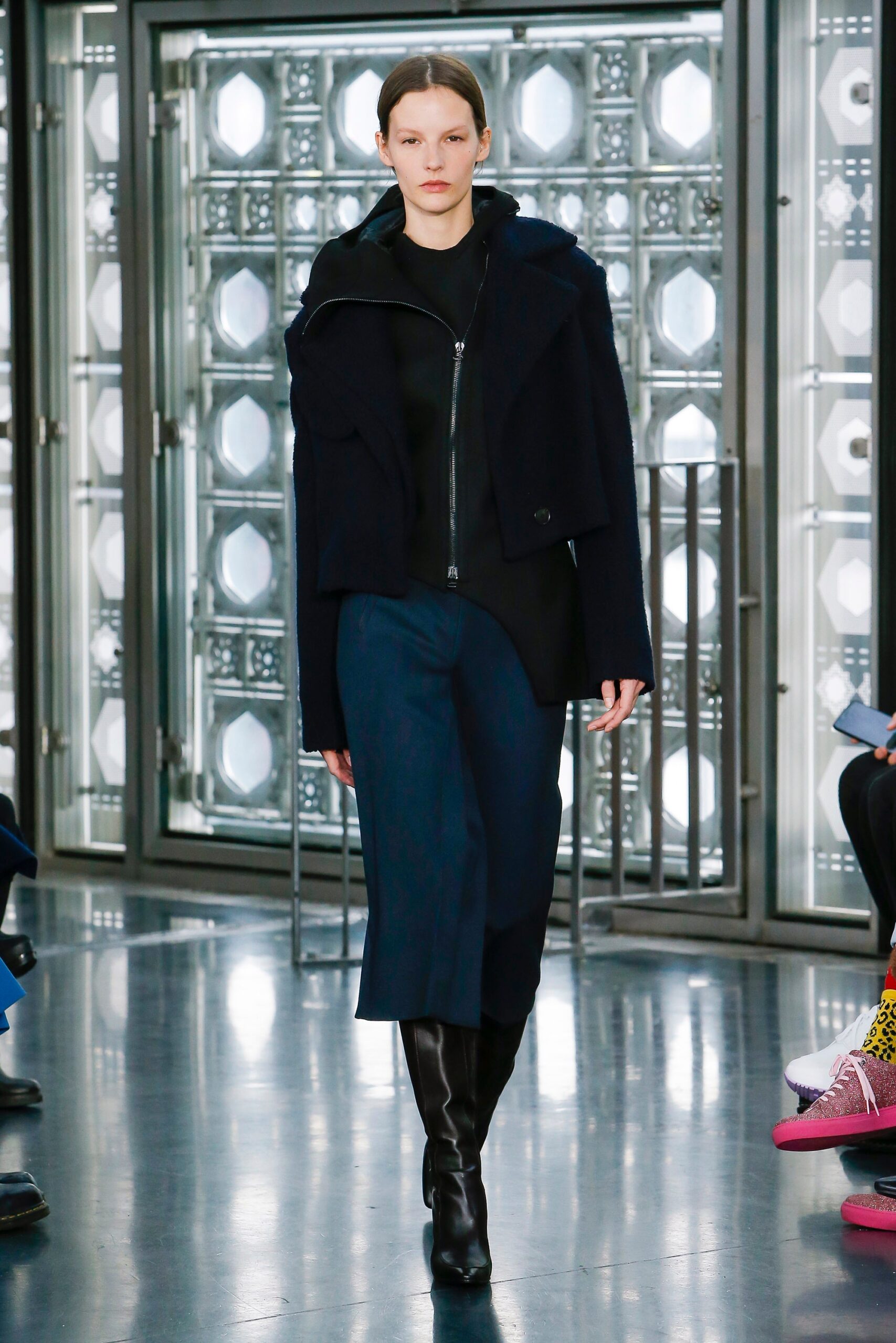black fitted jacket with blue tailored pants