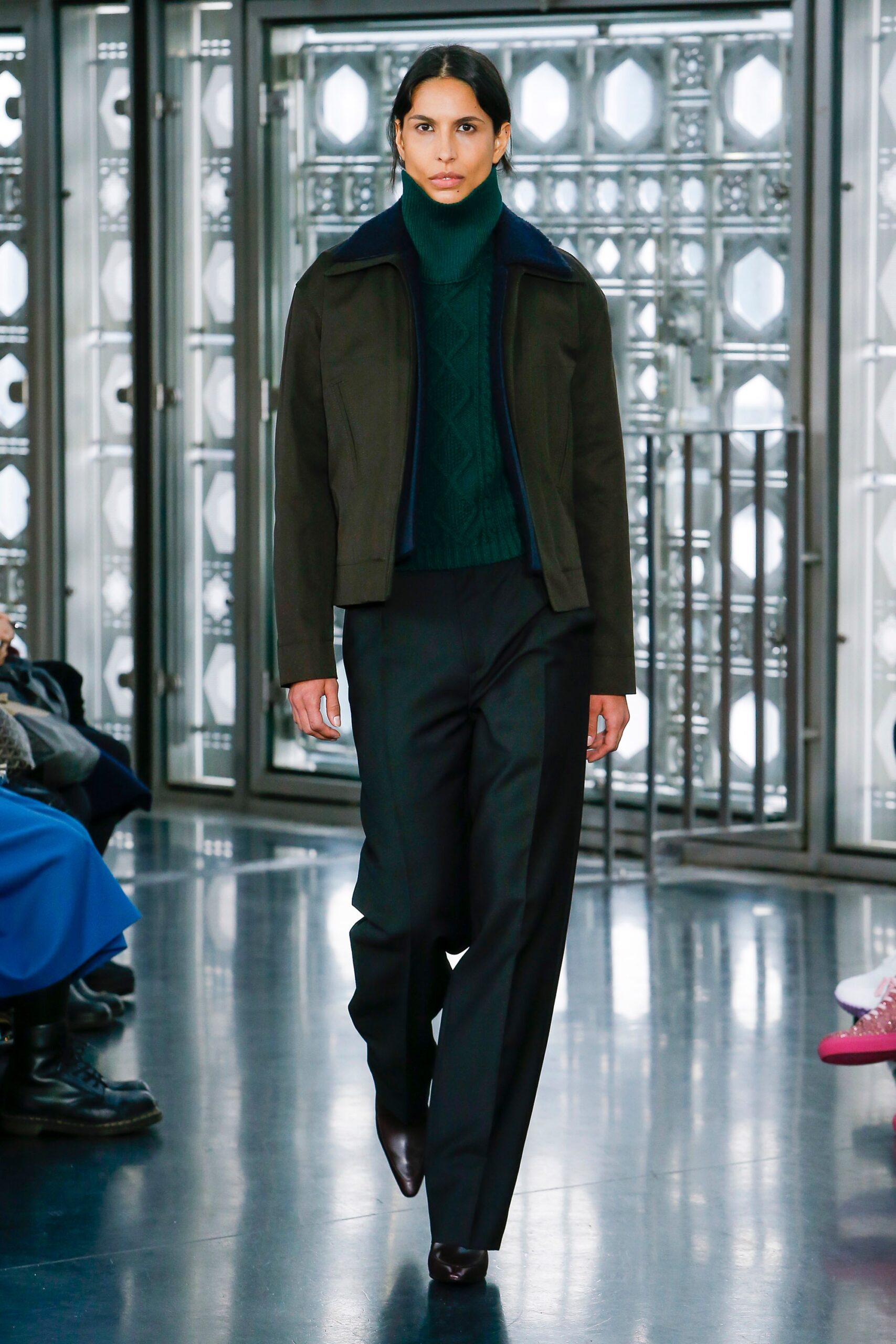 black jacket green sweater tailored pants