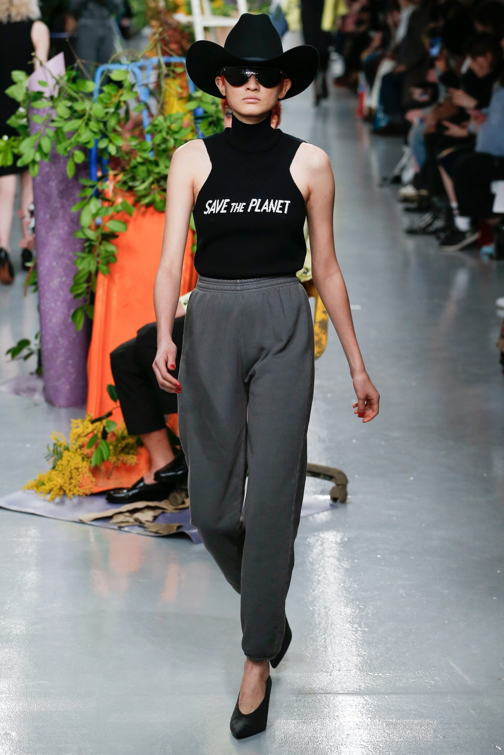 black fitted top with gray pants