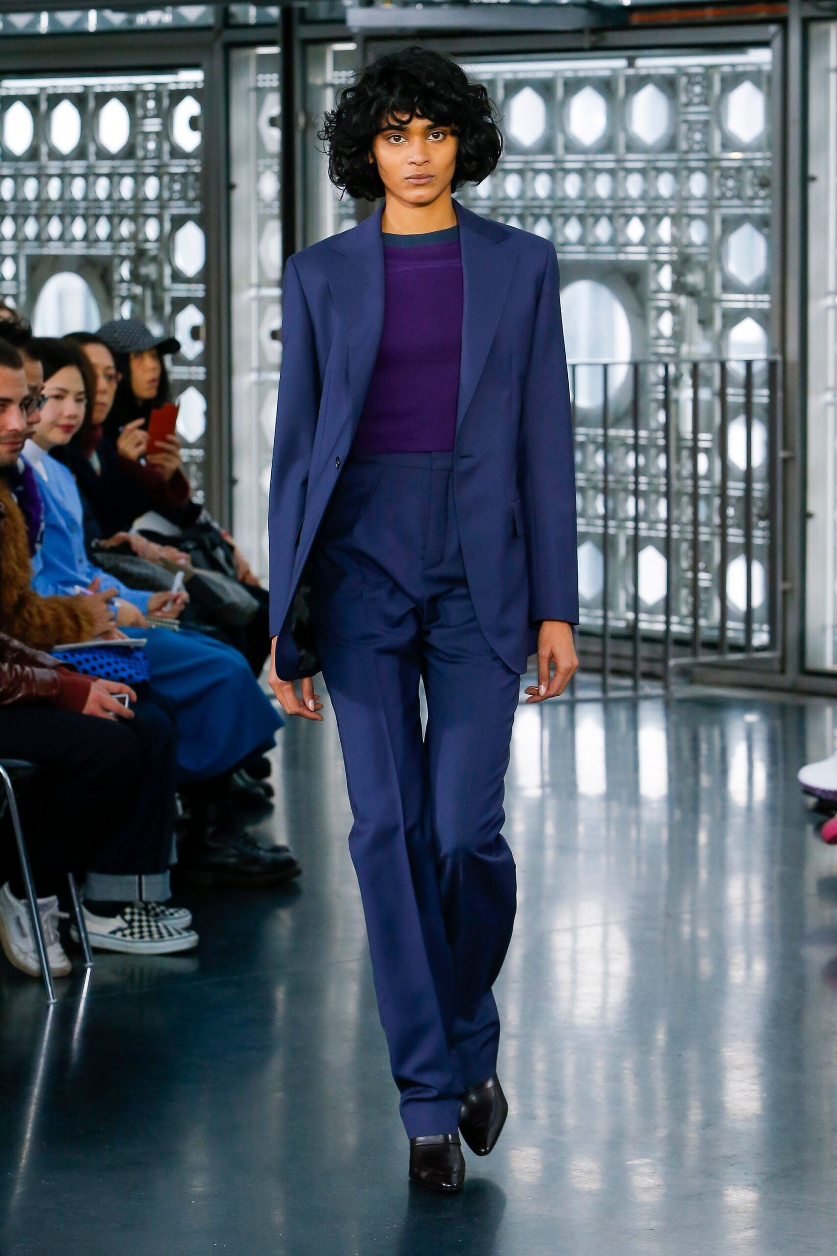 blue tailored suit with purple top
