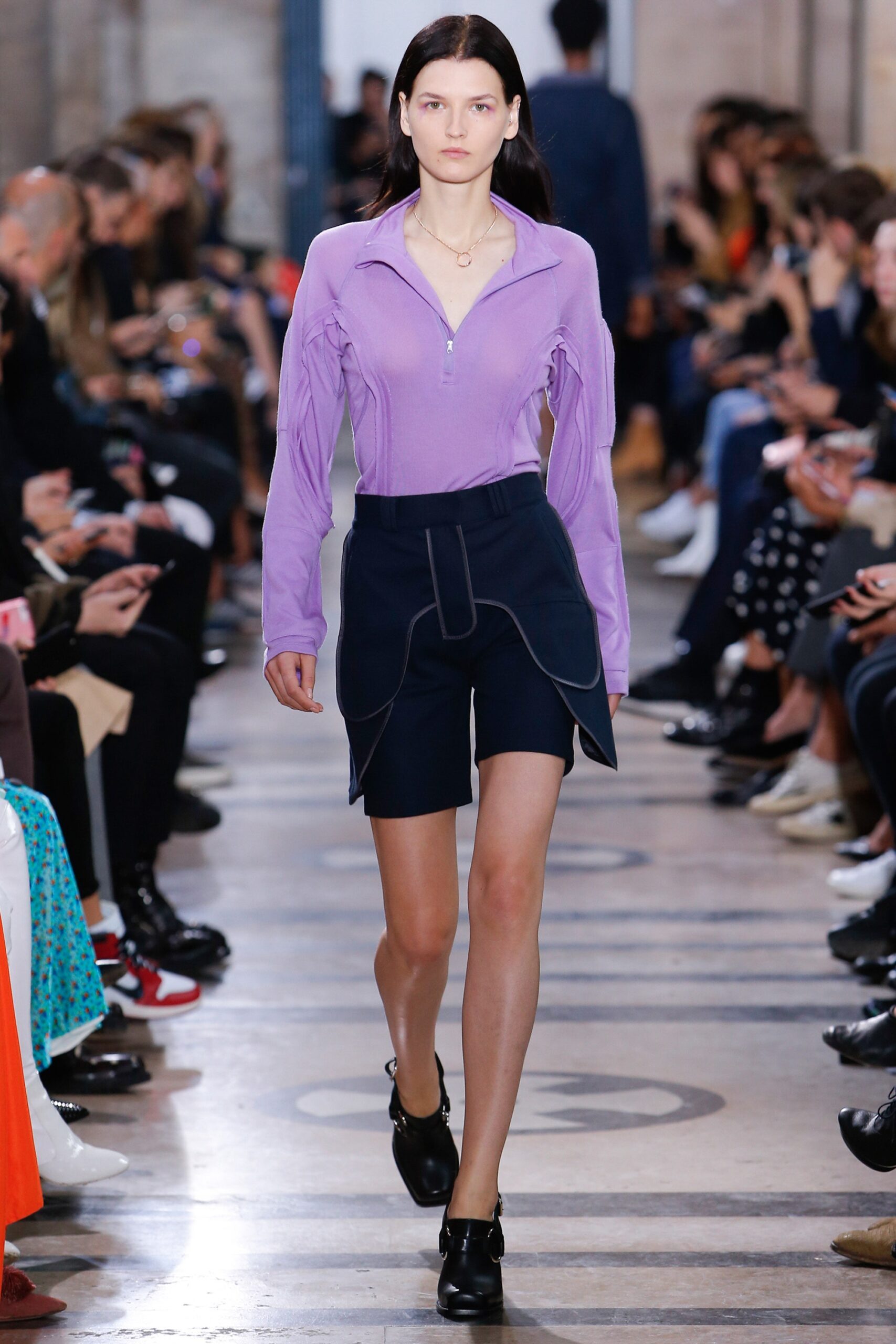 fitted purple top and navy shorts