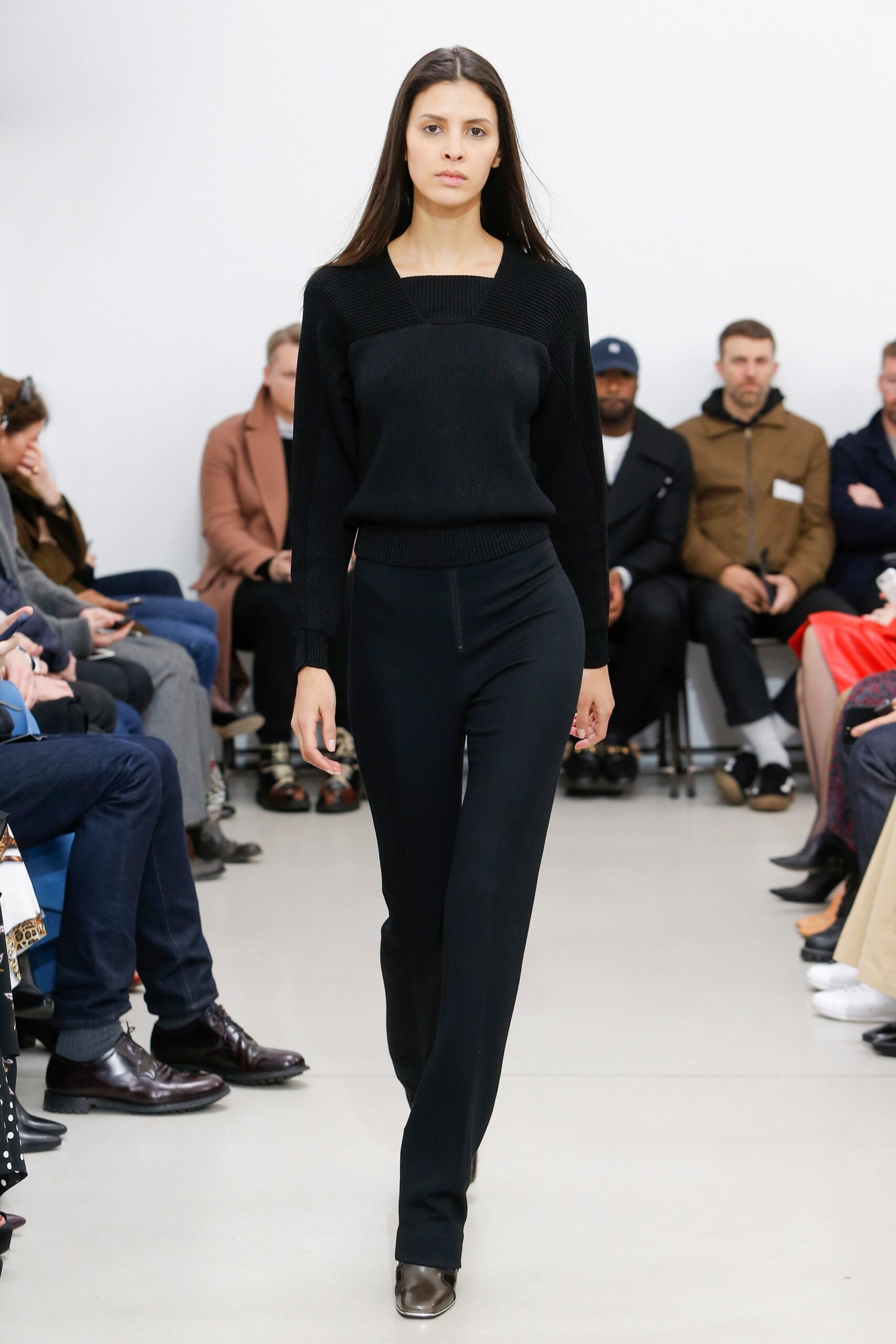 black fitted top and tailored pants