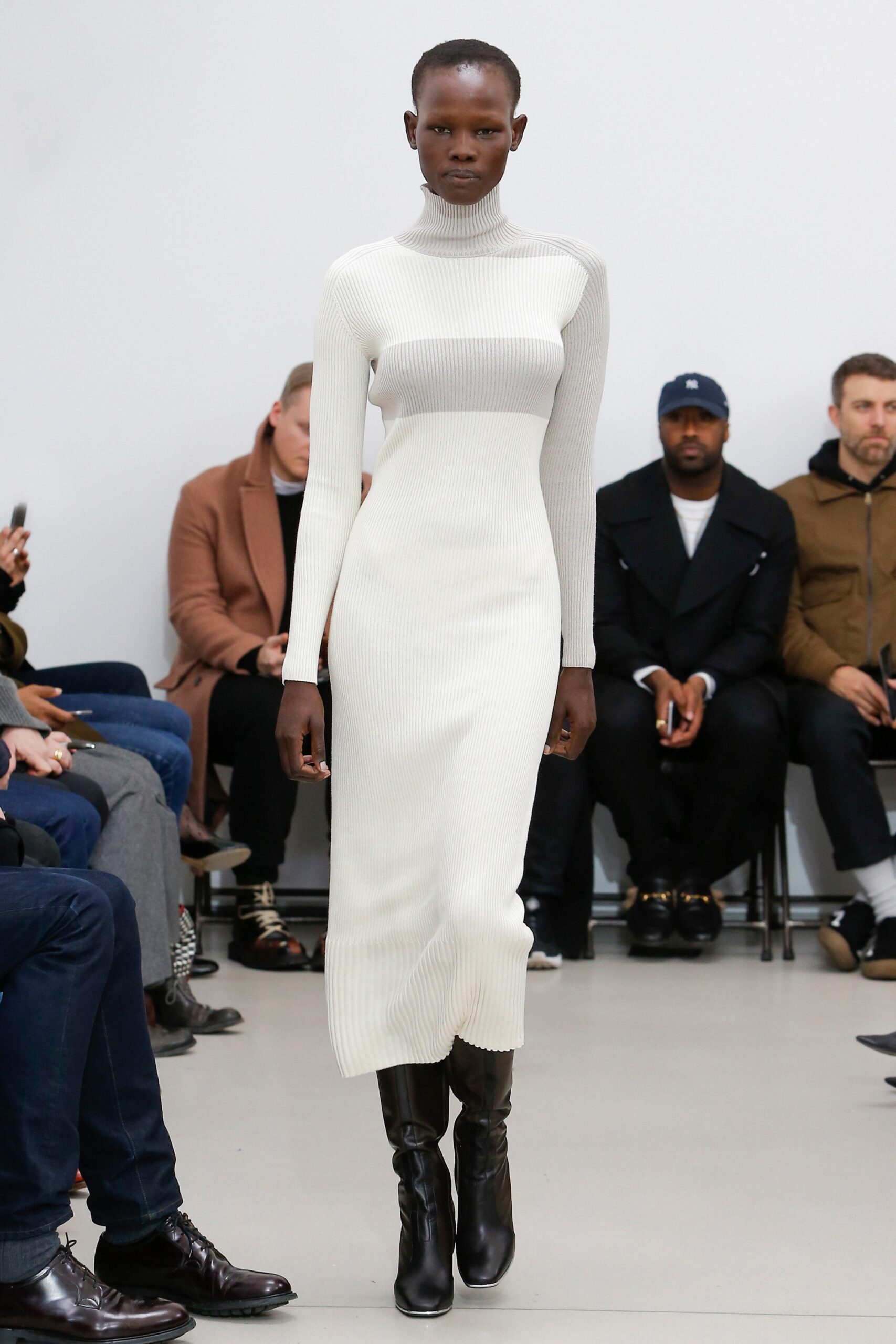 fitted white knit midi dress with black boots