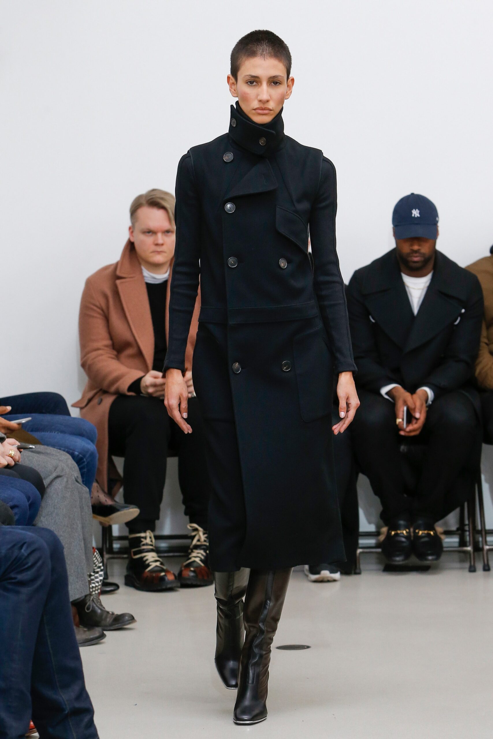 black fitted wool coat and boots