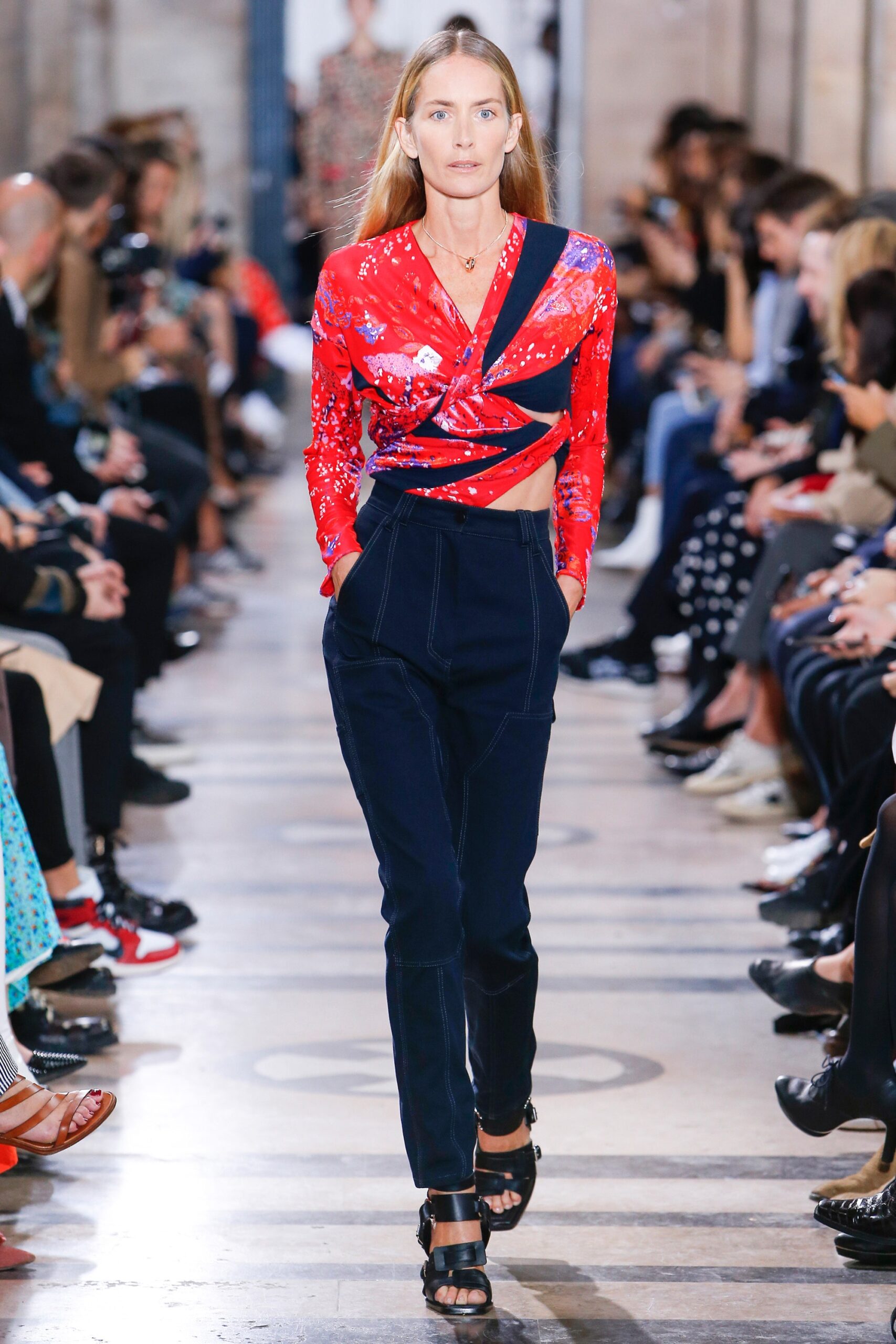 fitted red printed top with tailored navy pants