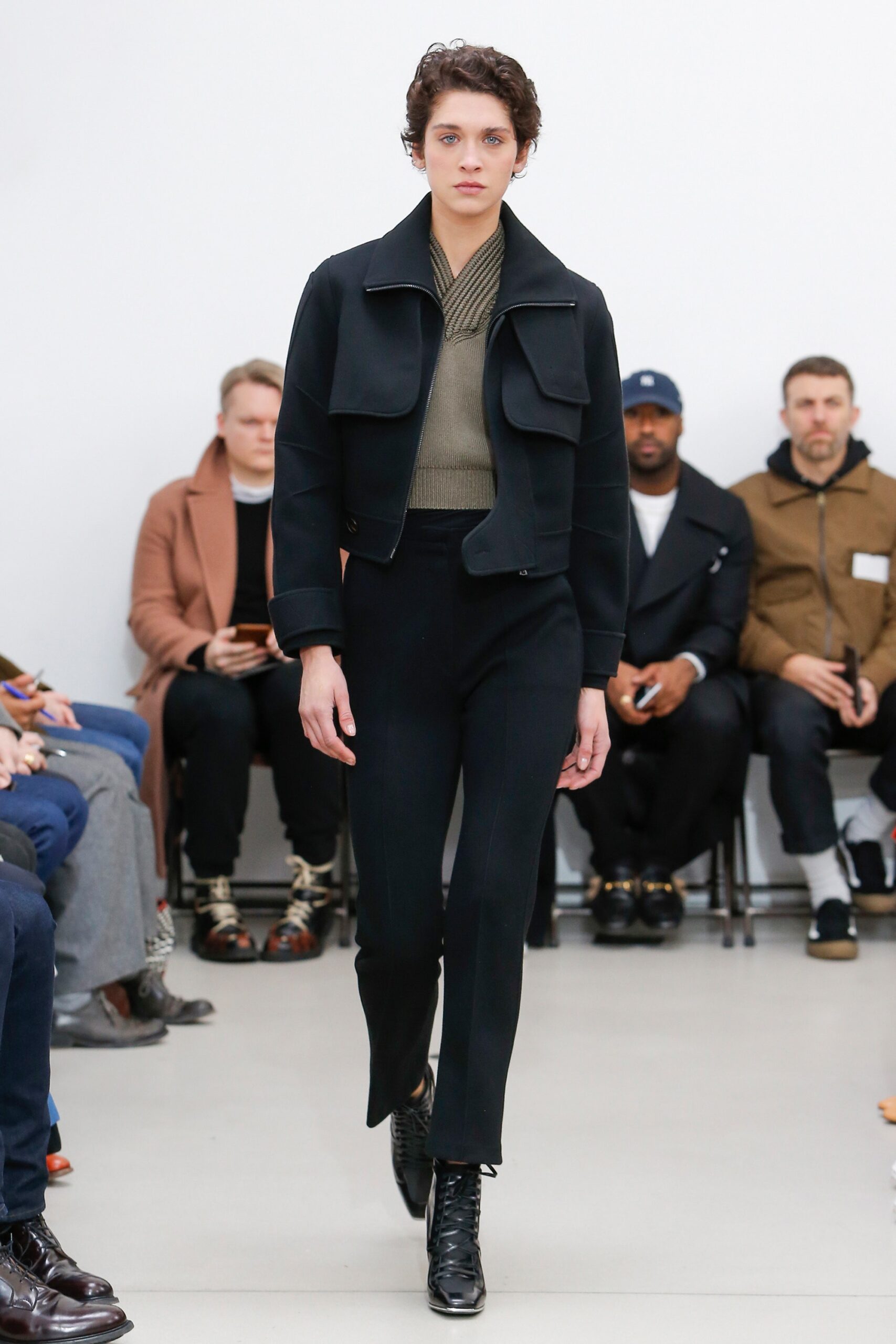 black fitted jacket with green top